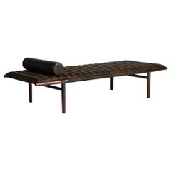 The EÆ Daybed in Horween leather with Ebonized Rosewood Legs and Blackened Brass