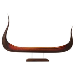 The East Wind, a red glass & oak viking ship by Backhaus & Brown and Egeværk