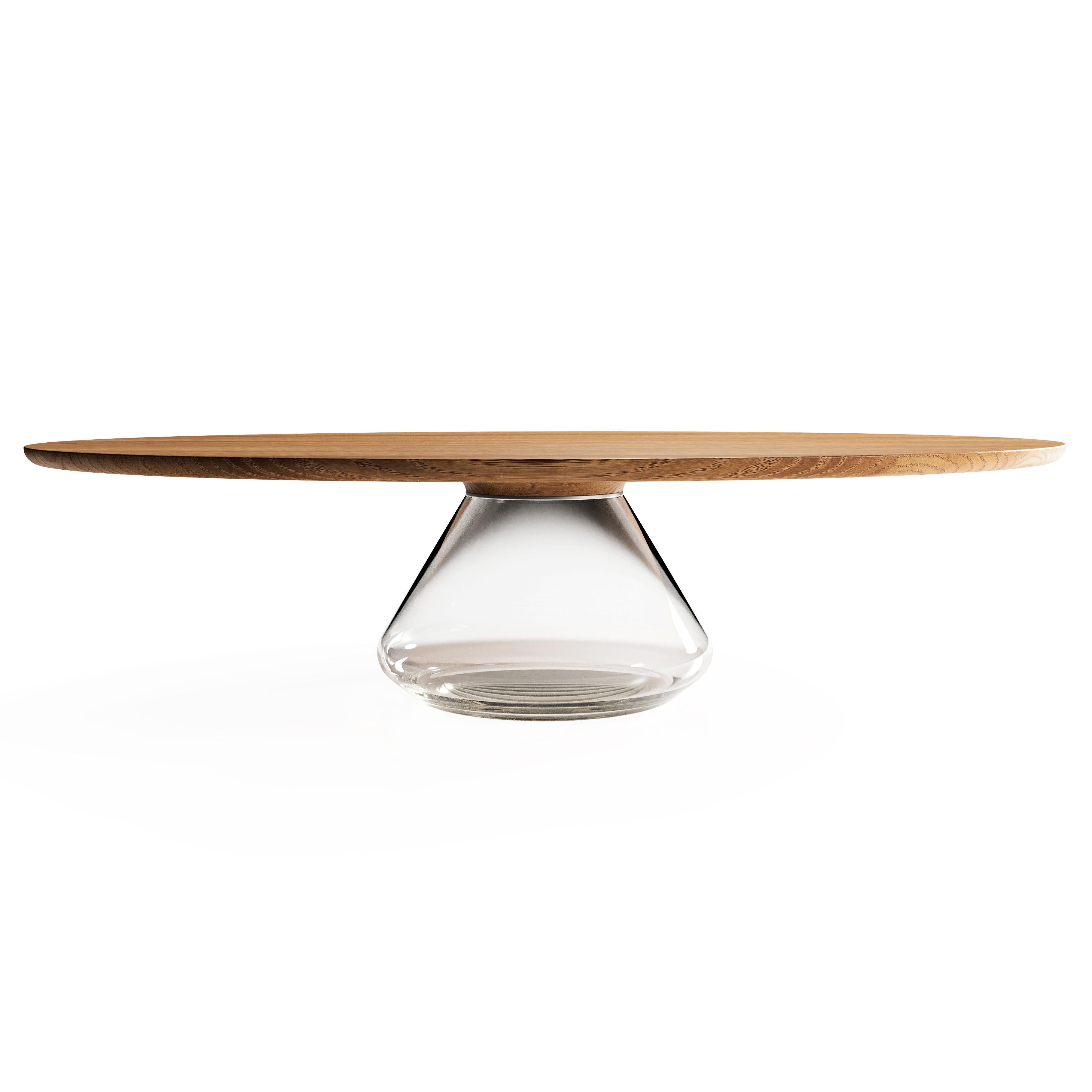 The Eclipse I, limited edition coffee table by Grzegorz Majka
Limited Edition of 8
Dimensions: 54 x 48 x 14 in
Materials: Glass, oak

The total eclipse of every interior? With this amazing table everything is possible as with its Minimalist