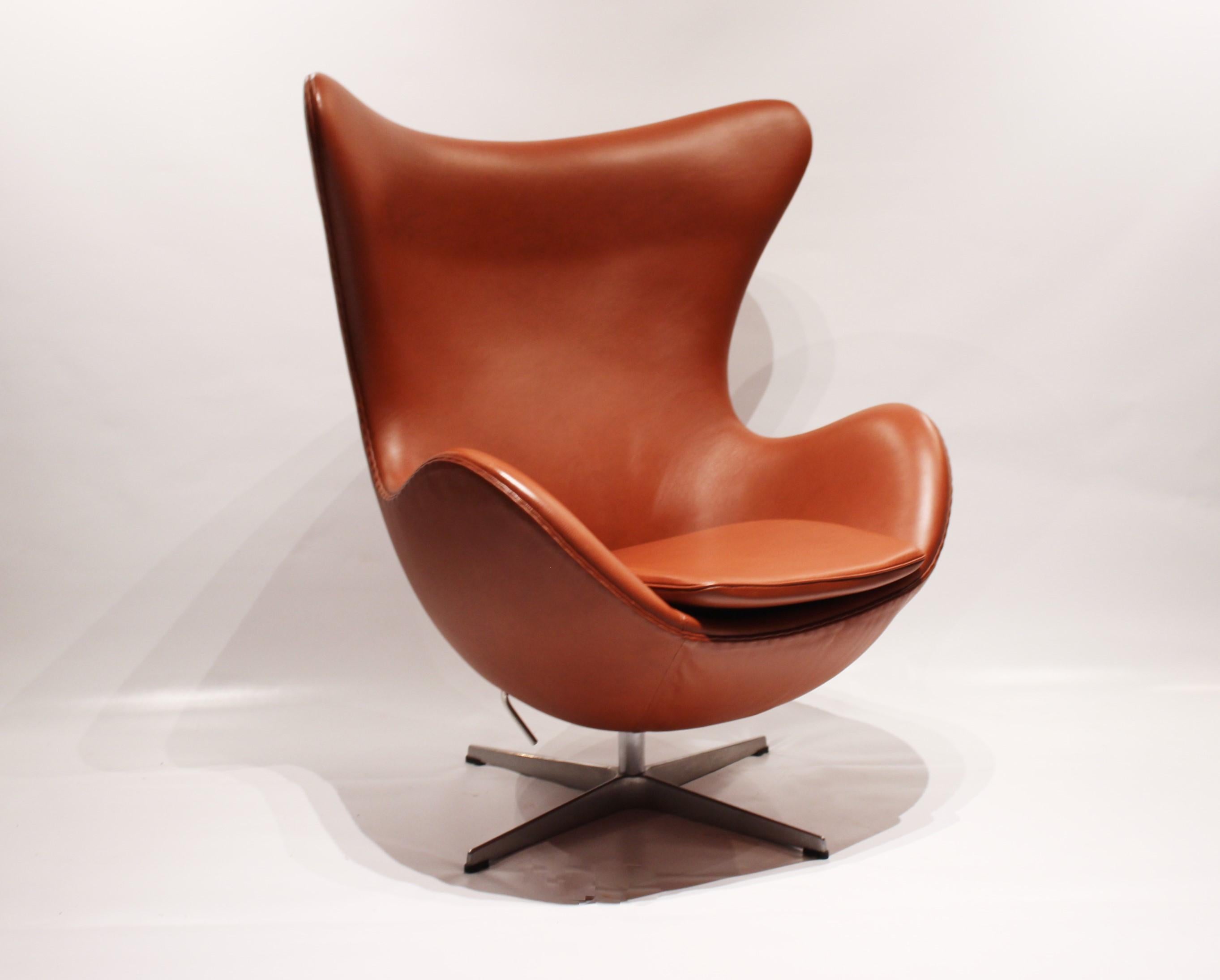 The Egg, model 3316, designed by Arne Jacobsen in 1958 and manufactured by Fritz Hansen in 2016. The chair is upholstered with cognac colored leather and is in great vintage condition. The chair was designed along with the Swan chair for a project