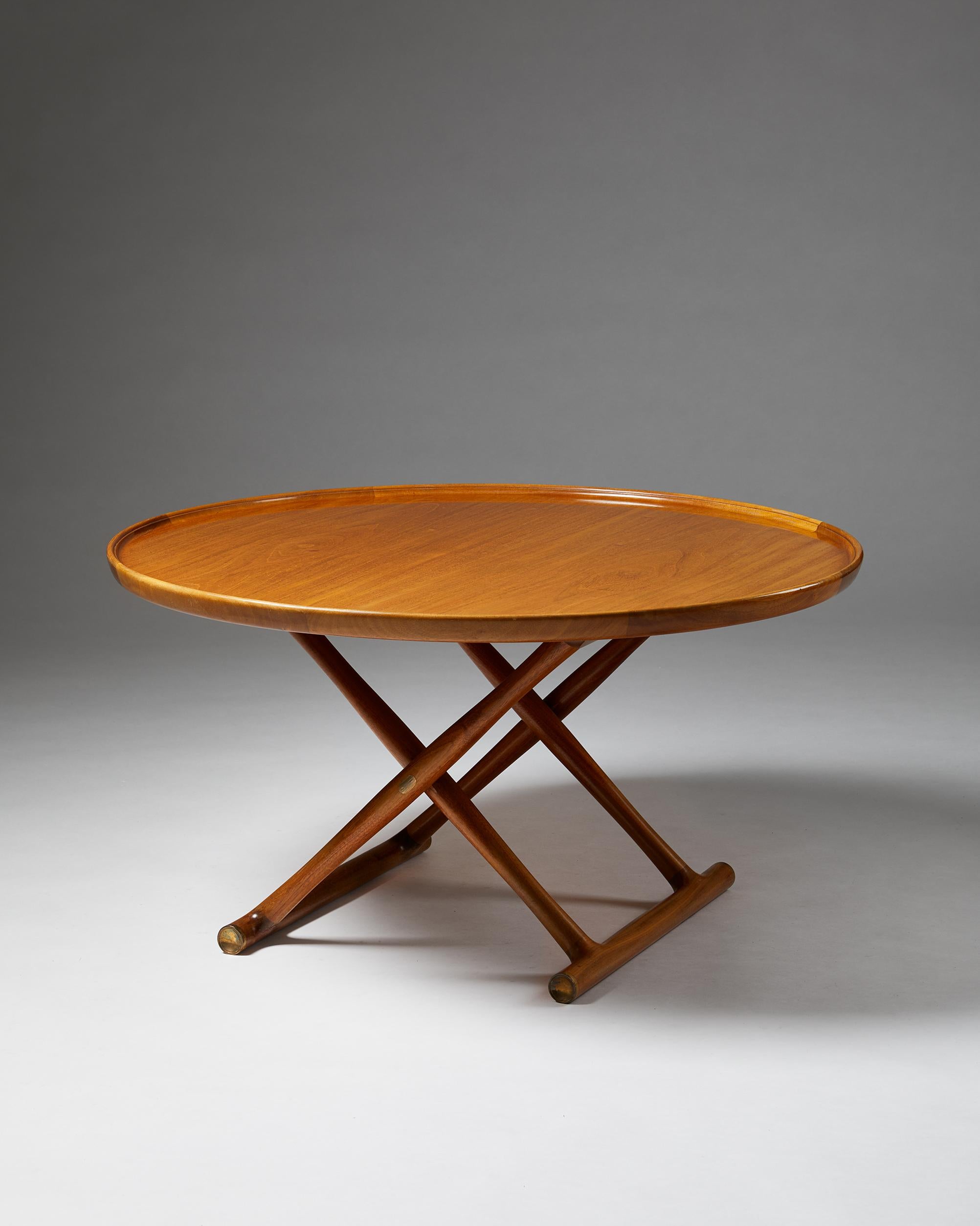 Occasional table “The Egyptian table”, designed by Mogens Lassen for Rud Rasmussen, Denmark. 1935.

Mahogany, foldable frame and top with raised edge, brass fittings.

Dimensions: 
H: 52 cm / 1' 9