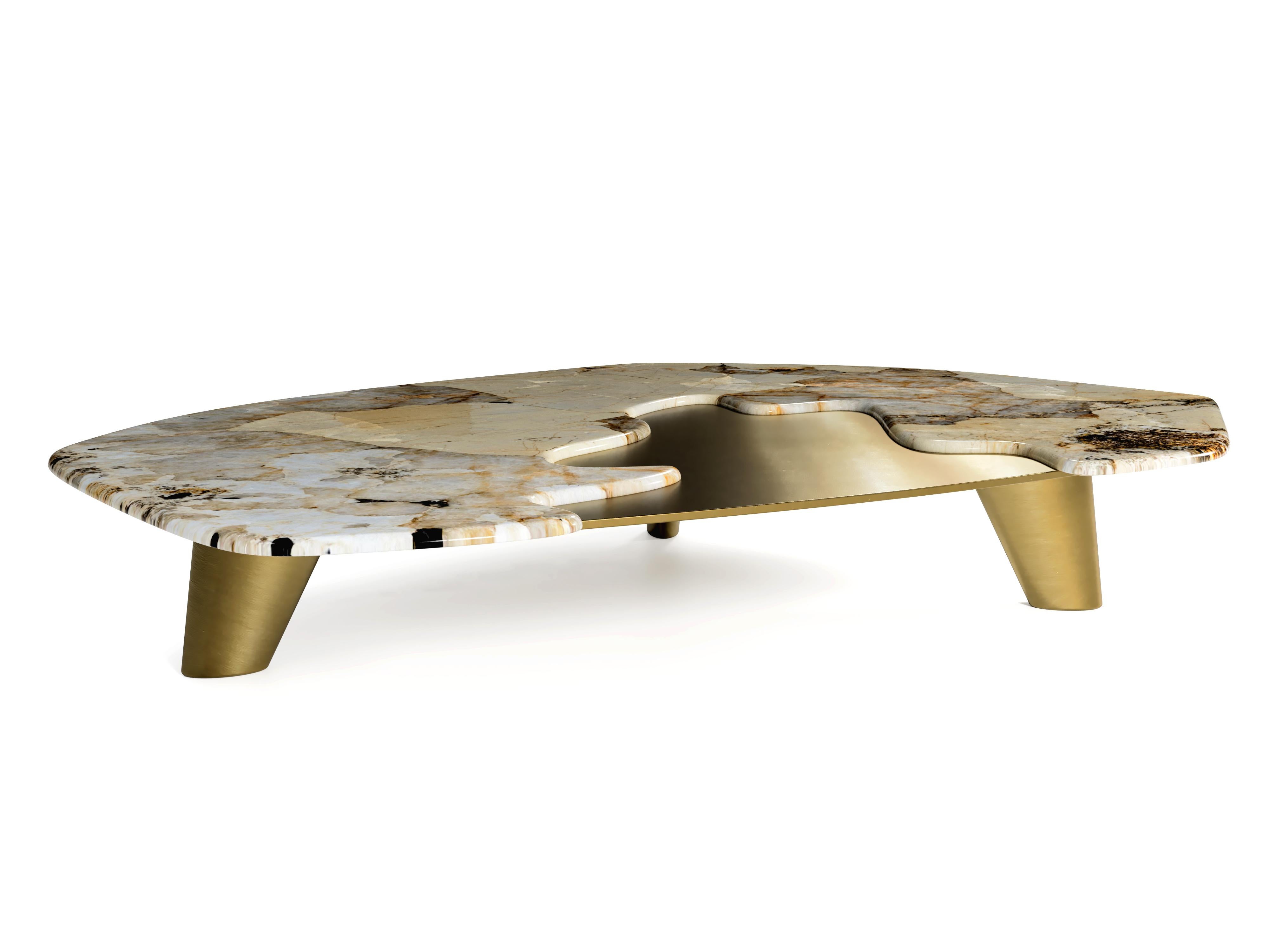 “The Elements IV” Contemporary Center Coffee Table ft. natural quartzite Patagonia and solid brass plate in brushed finish.

Created of the two totally different shapes, structures reveals some symbiotic influence between each other. One delicate -