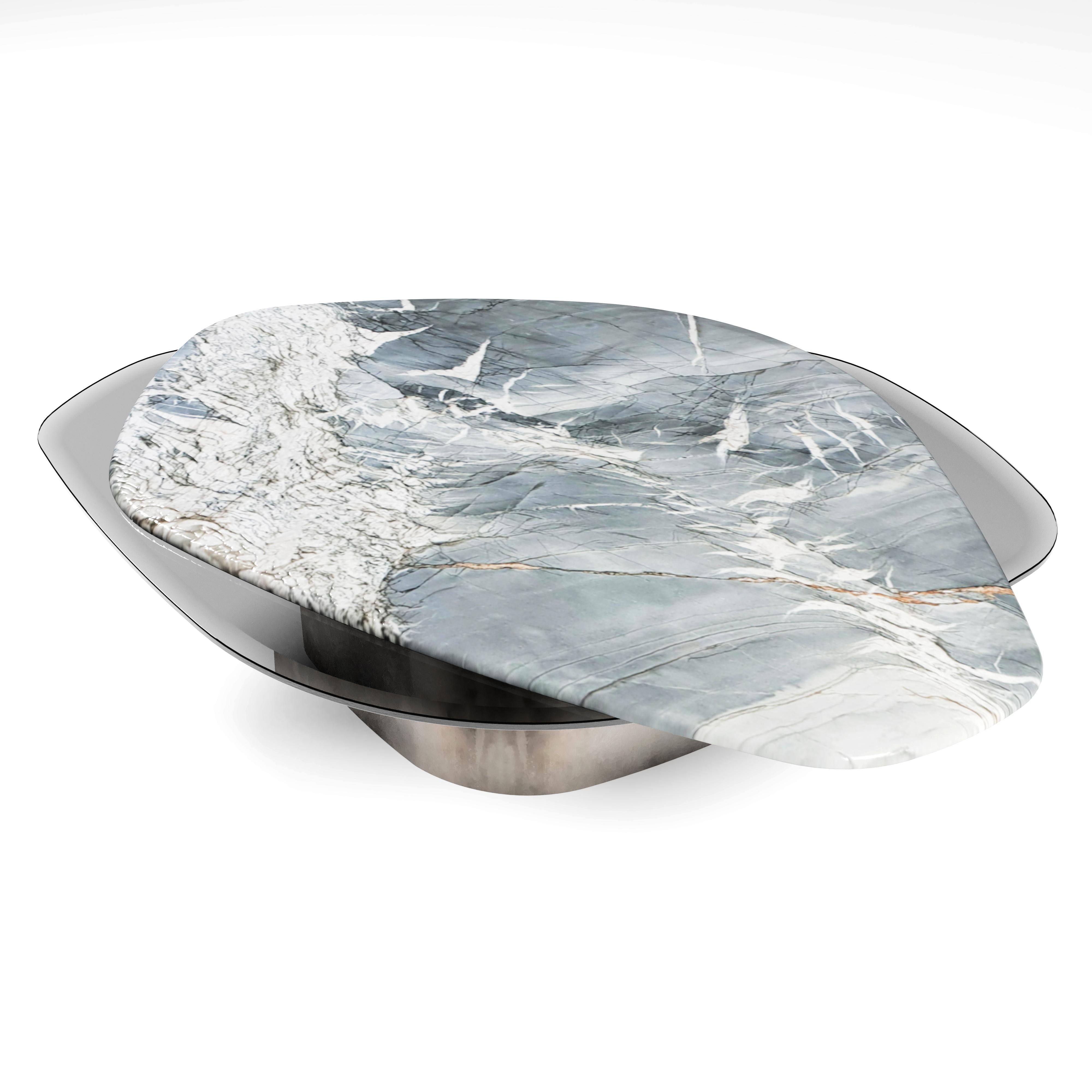 “The Elements VI Contemporary Center Coffee Table ft. Venom quartzite and tempered smoked glass tops with row stainless steel base.

Created of the two totally different shapes, structures reveals some symbiotic influence between each other. One