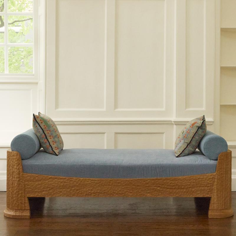 Introducing the Ellie Daybed – a stunning piece of furniture that’s inspired by the majestic African Forest Elephant. Hand carved with an Adze texture from high-quality oak that is burnished and clear oiled.
The Ellie Daybed features a plush feather
