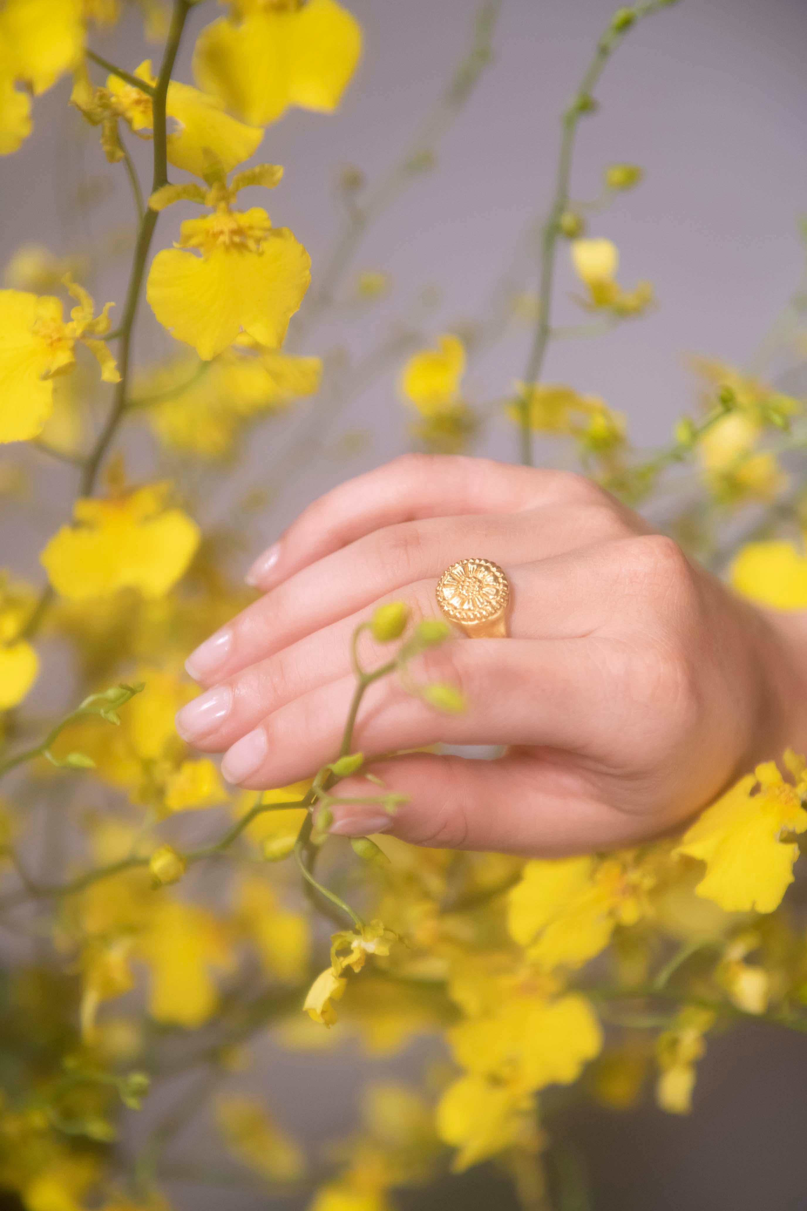 The Ellis Ring is a heavy, completely solid rustic signet-style ring, a true flowerbomb on your finger, cast in a buttery warm 22k gold.

This ring is hand carved from wax by Rosa de Weerd and cast by her local foundry in Amsterdam. The shoulders