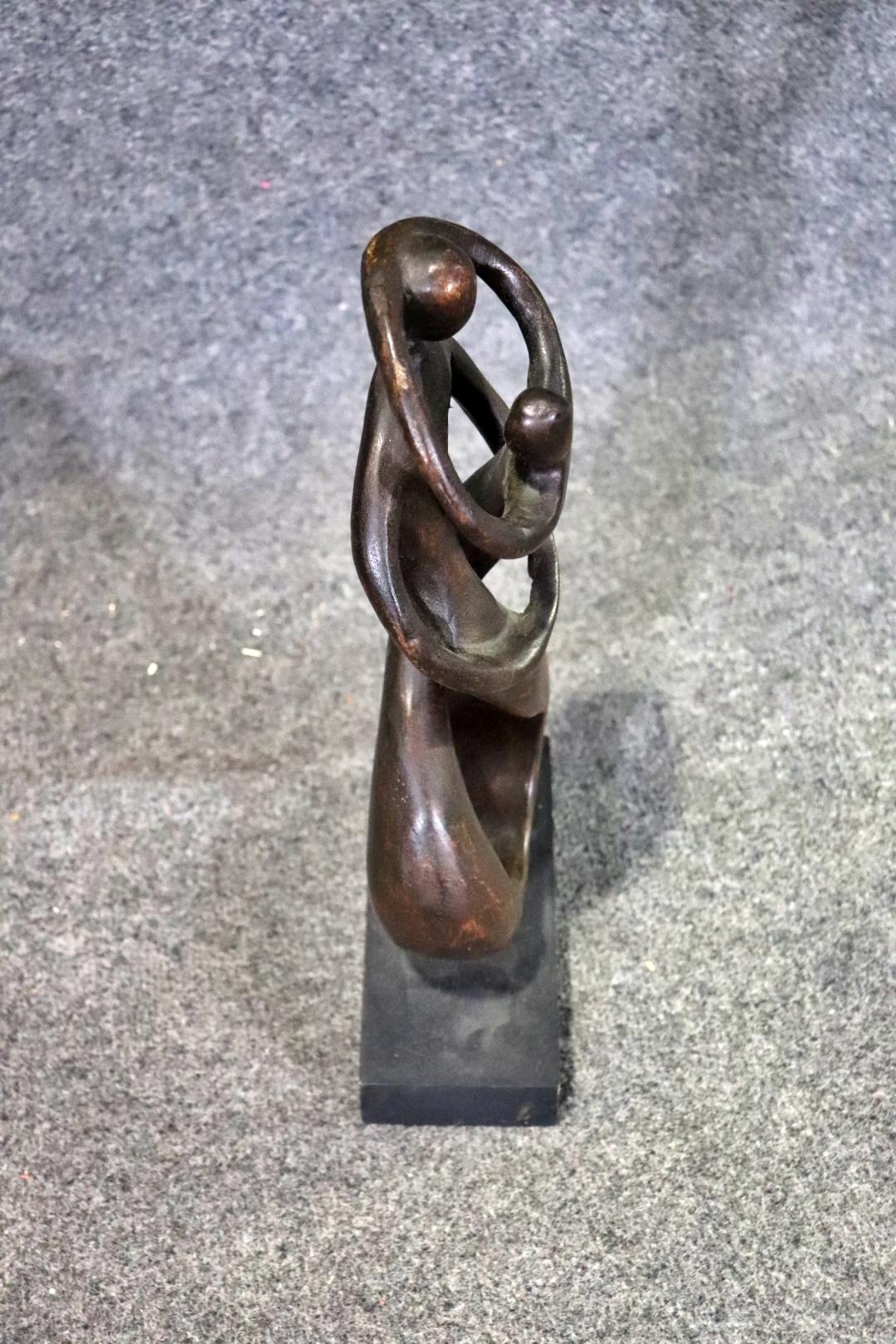 Beautifully sculpted piece of wood on pedestal. Two people intertwined in an embrace.
Please confirm location NY or NJ