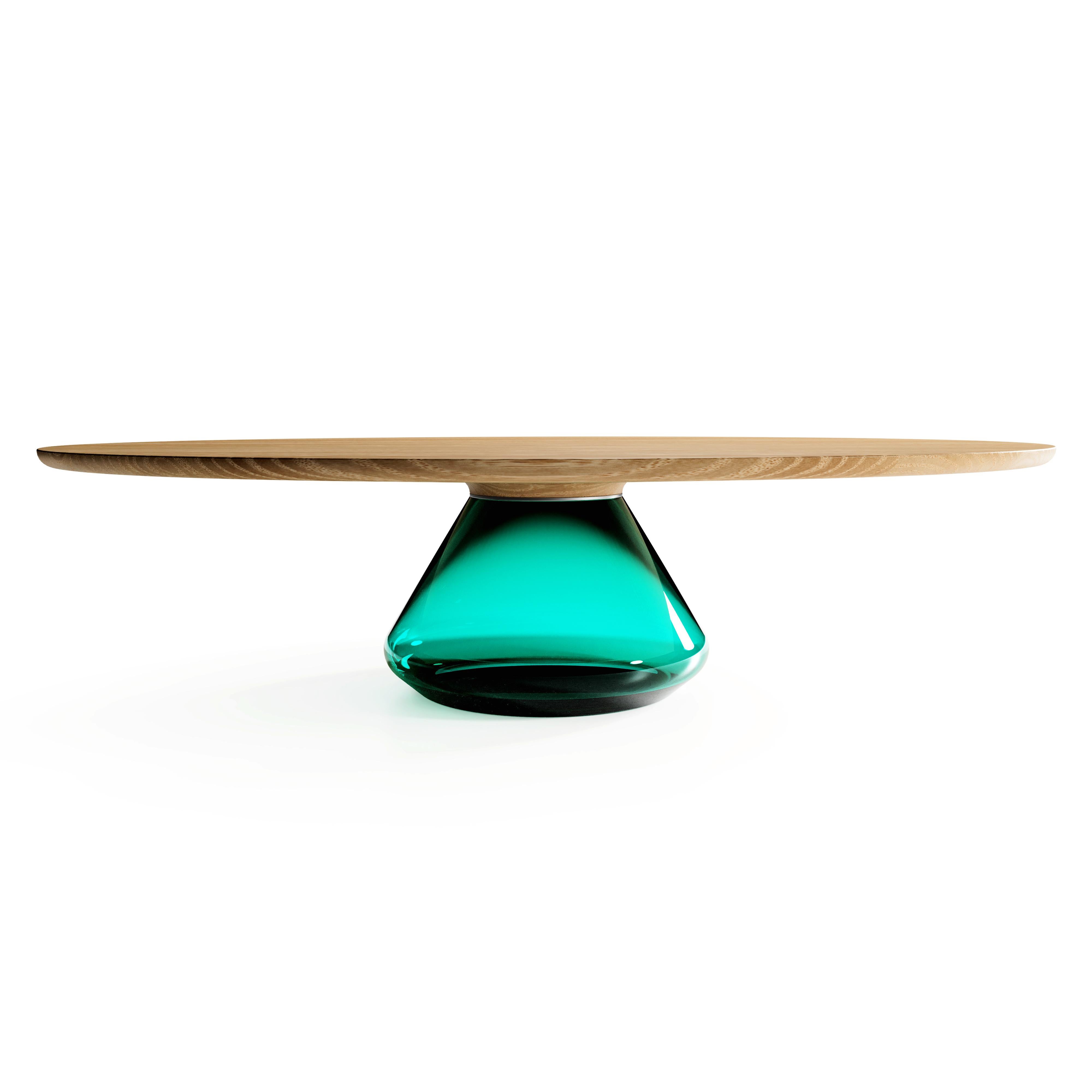 The emerald Eclipse I, limited edition coffee table by Grzegorz Majka
Limited edition of 8
Dimensions: 54 x 48 x 14 in
Materials: Glass, oak

The total eclipse of every interior? With this amazing table everything is possible as with its