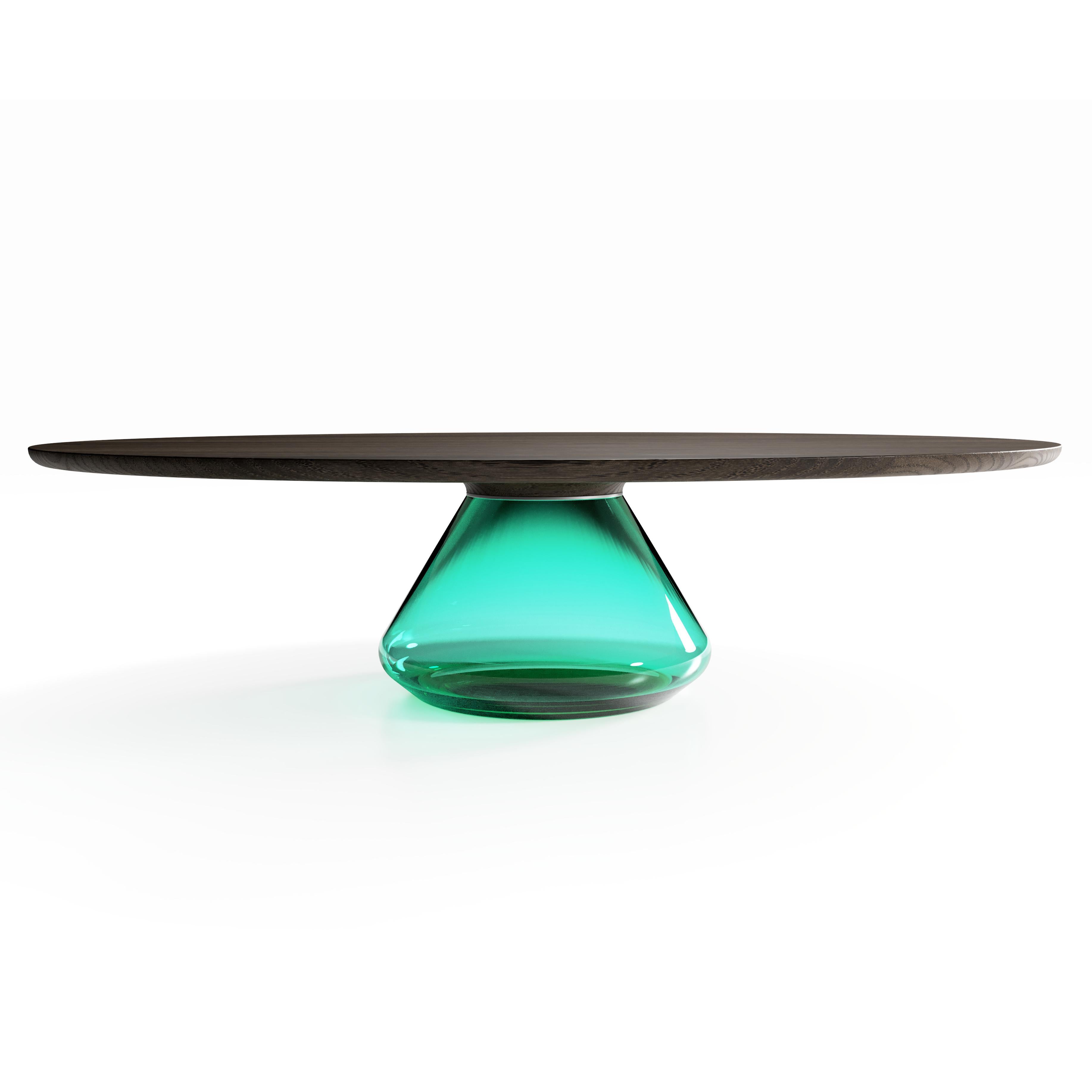 The Emerald Eclipse I, limited edition coffee table by Grzegorz Majka
Limited Edition of 8
Dimensions: 54 x 48 x 14 in
Materials: Glass, oak

The total eclipse of every interior? With this amazing table everything is possible as with its