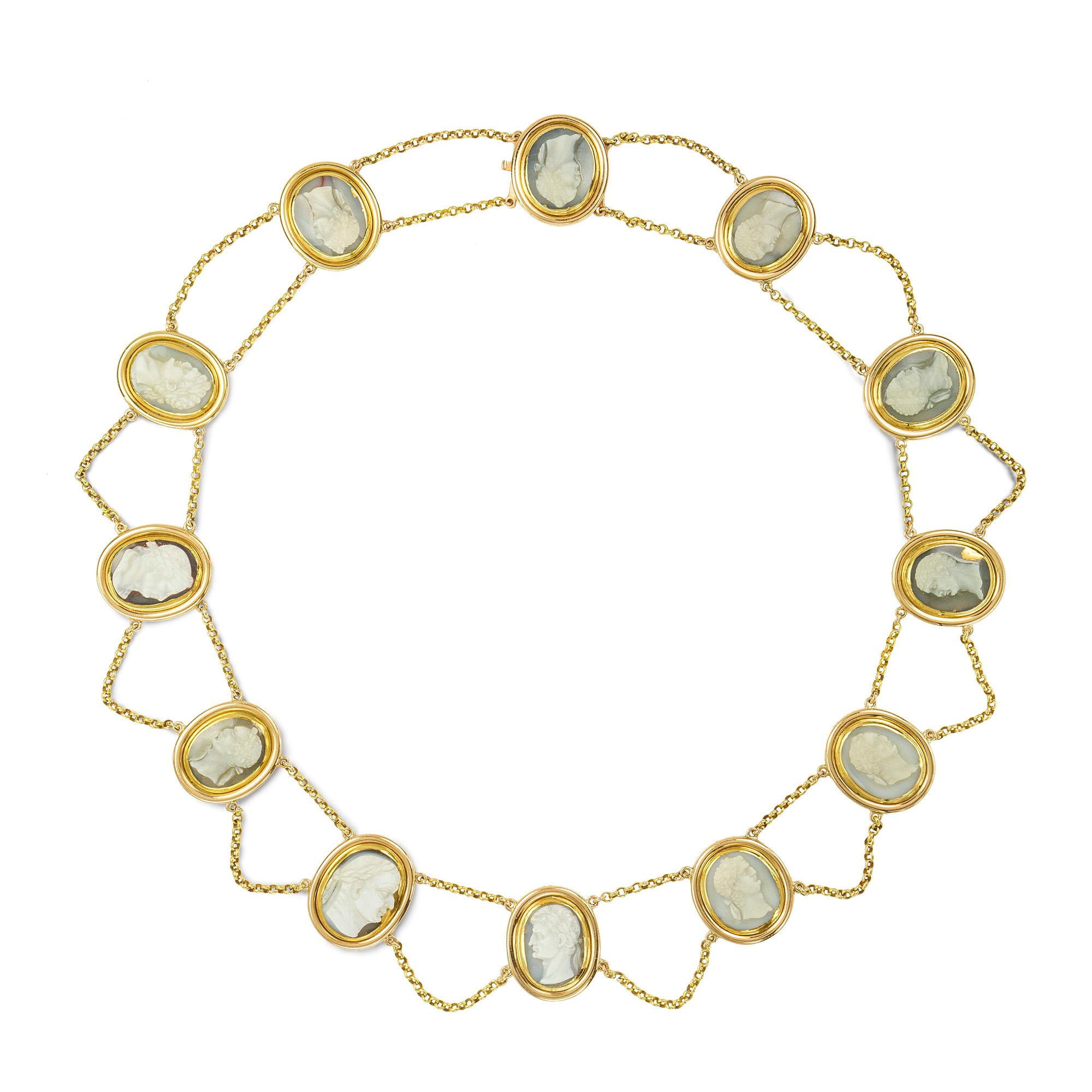 The Emperors Necklace, an early Victorian hardstone cameo necklace, the twelve oval chalcedony cameo plaques, each carved with the profile of a Roman Emperor, all mounted in close-backed yellow gold rub-over settings, each with the name of the
