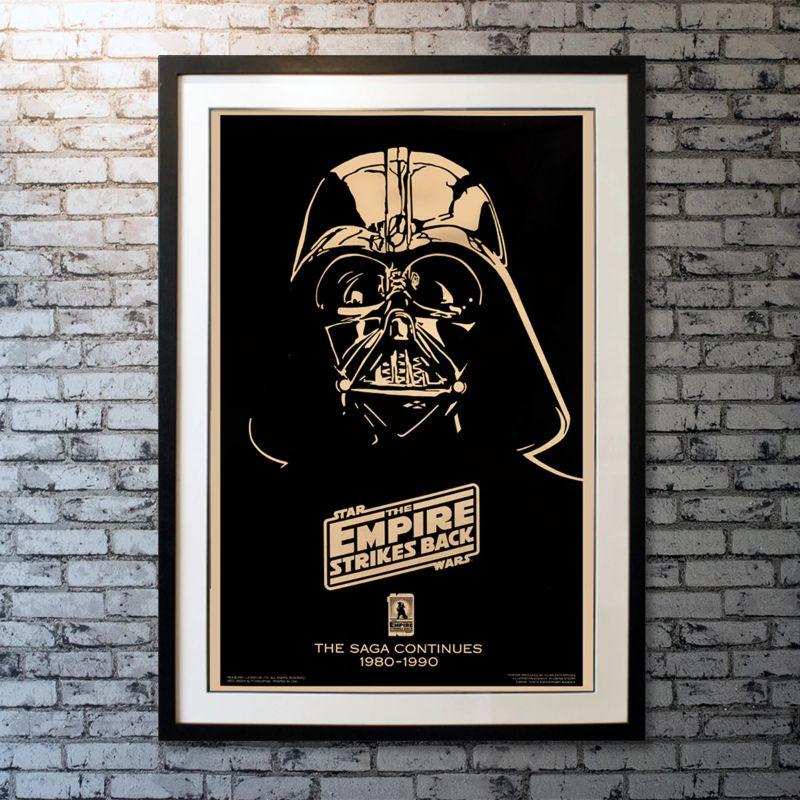 The Empire Strikes Back, Unframed Poster, 1990

Original One Sheet (27 X 41 Inches). Gold Mylar 10th anniversary 1990 poster. Darth Vader is adamant about turning Luke Skywalker to the dark side. Master Yoda trains Luke to become a Jedi Knight