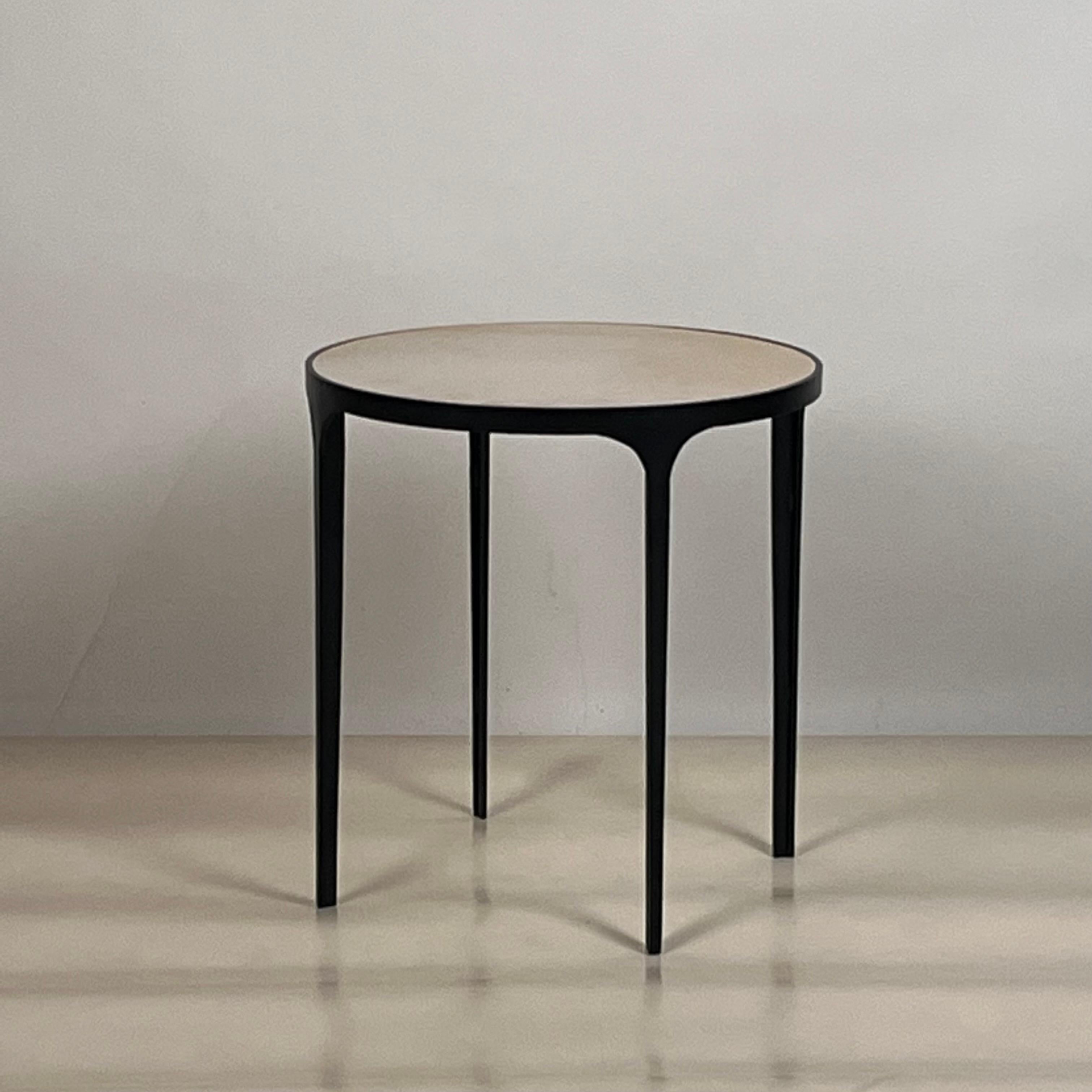 Round 'Esquisse'™ wrought iron and parchment side table by DESIGN FRÈRES®.

Real parchment-clad top. Chic and understated.

This Esquisse™ table is an exclusive DESIGN FRÈRES® design. Parchment is a natural material and surface patterns may vary.