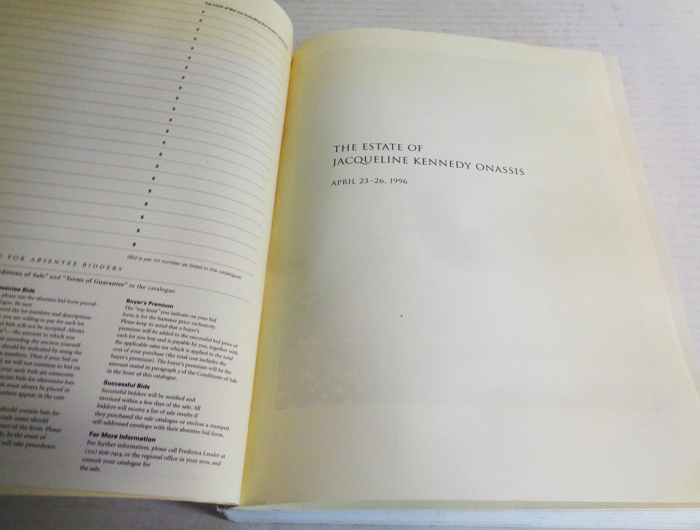 The Estate Of Jacqueline Kennedy Onassis: April 23-26. 1996 - Sotheby's, New York - Auction Catalog. 1st edition. Ivory colored softcover book w/ silver lettering. 584 pages / nine sessions w/ 1195 illustrated lots in b/w and full color. 
absentee