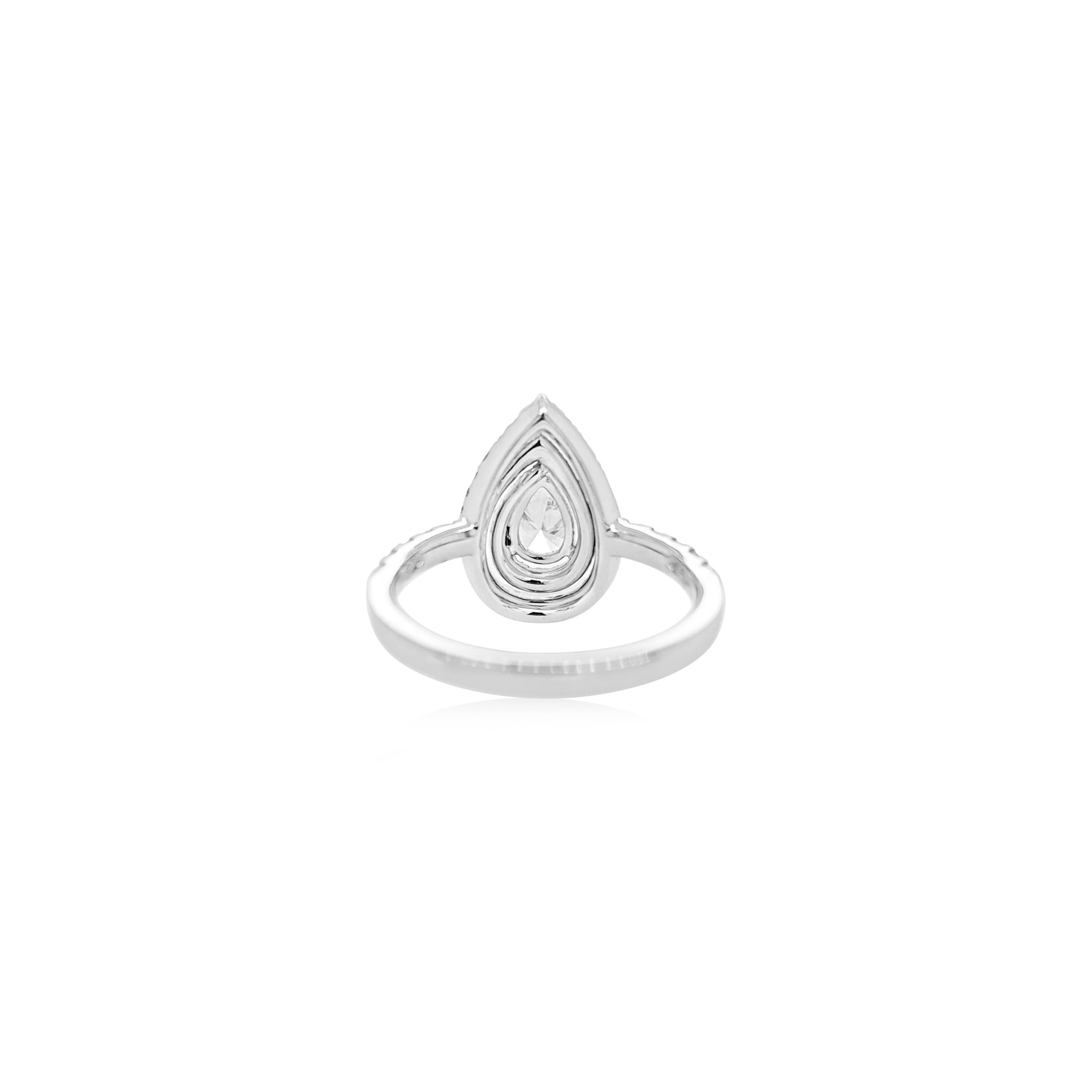 A timeless masterpiece featuring a stunning pear-shaped white diamond, embraced by a halo of round brilliant diamonds and a delicate diamond-studded band. Celebrate sophistication and brilliance in every detail

Pear Shape White diamonds: 0.45 cts
