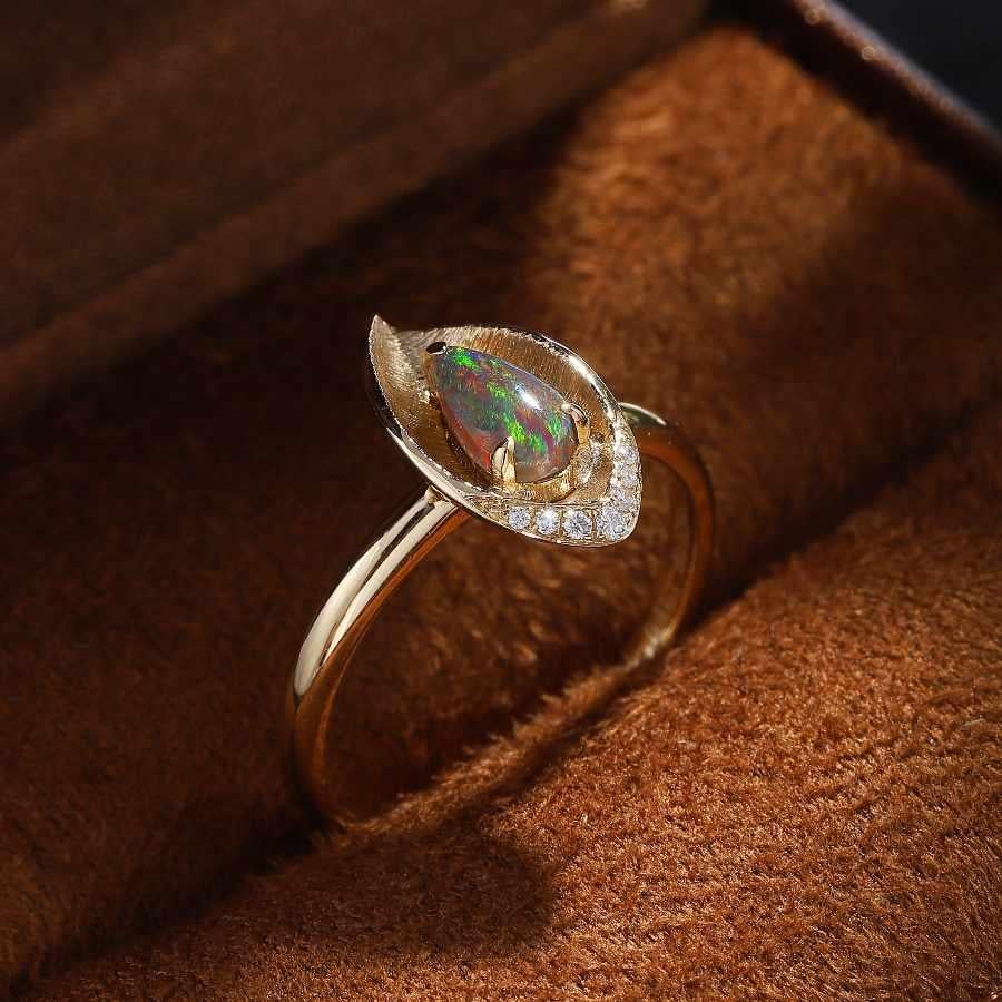 The Everleaf - Australian Black Opal Diamond Engagement Wedding Ring 18K Yellow Gold.



Opal—the queen of gemstones, is one of the most beautiful gemstones in the world. Every piece of opal is unique in its own ways and patterns. We only use