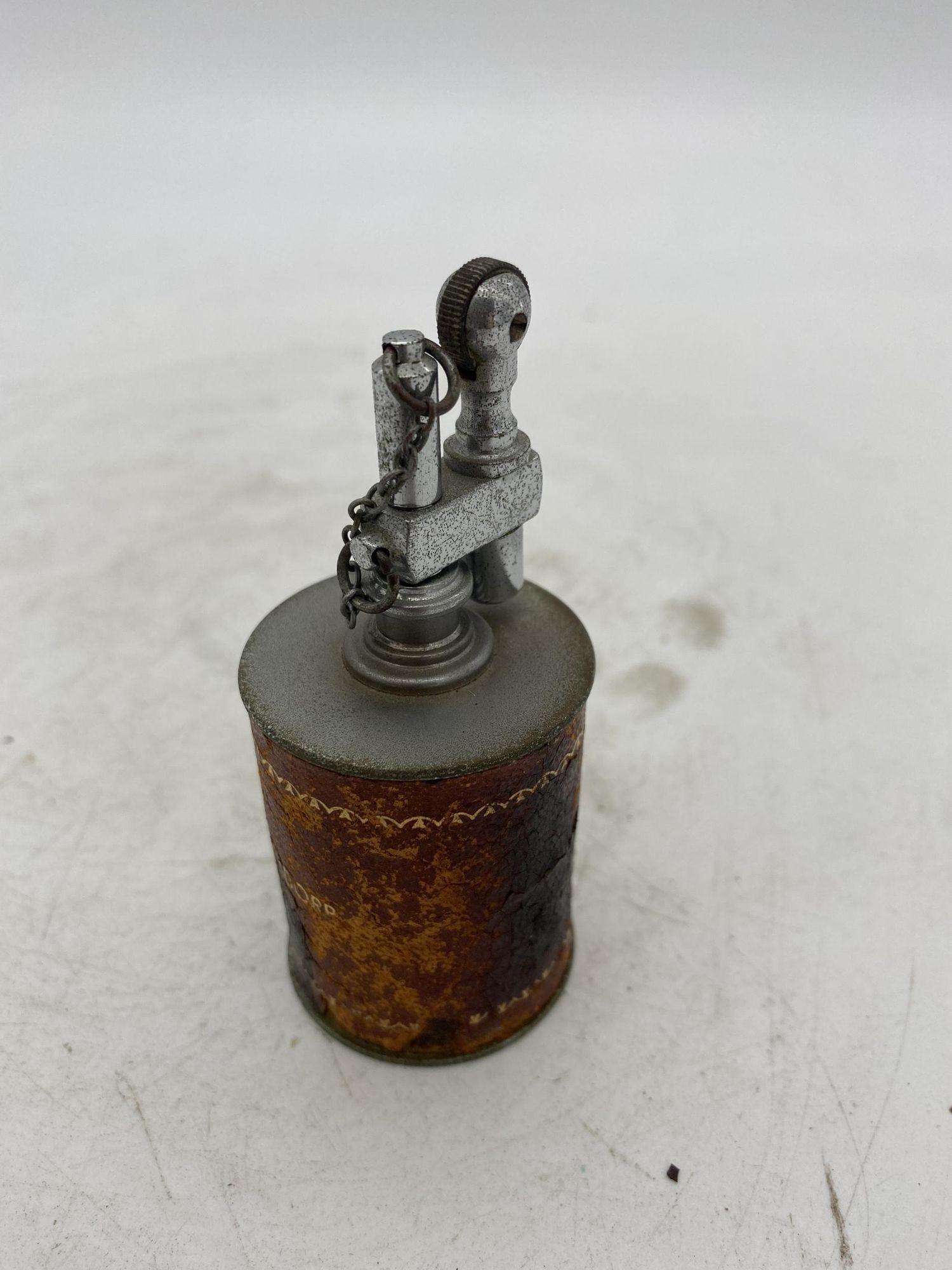Antique Table Cigarette Lighter By AR, The Executive. Leather Wrap, Chrome. , Circa 1930.
 
It is in great antique condition and measures 3 1/2 inches tall.