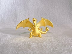 Le Charizard exquis en or jaune 24 carats