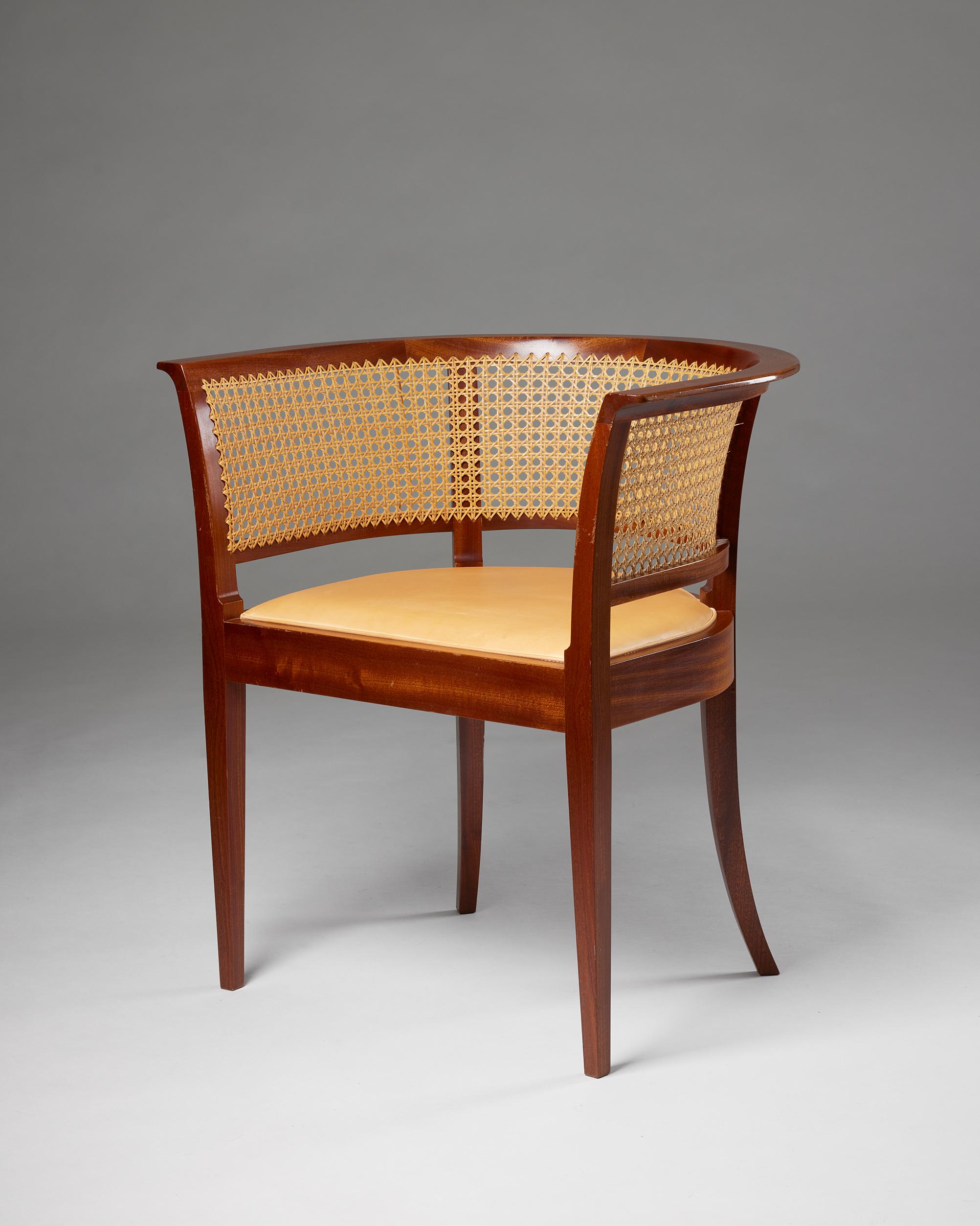 ‘The Faaborg Chair’ designed by Kaare Klint for Rud. Rasmussen Cabinetmakers
Denmark, 1914.
Mahogany, woven cane and leather.

Designed in 1914 for the Faaborg Museum. This example was made in the 1960s.

H: 73 cm
W: 69 cm
D: 54 cm
Seat H: 45
