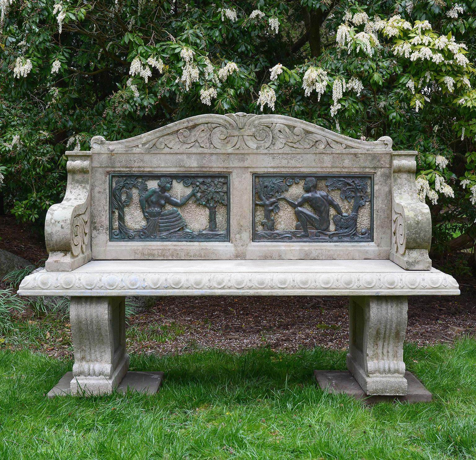A garden seat, the carved stone camel-form back with scrolled crest above inset bronze panels in the Art Deco style, the panels representing the Fall season, with one panel depicting a female figure picking apples and another depicting a male figure