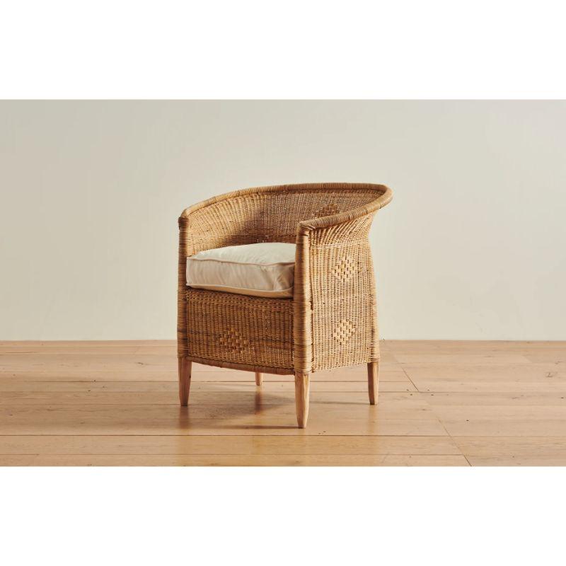 This Malawi Cane lounge chair artfully combines handwoven cane in a closed weave pattern and solid wood with a plush linen and down-filled cushion, bringing long-lasting comfort to nearly any interior setting.

Here at ZZ, we are thrilled to be