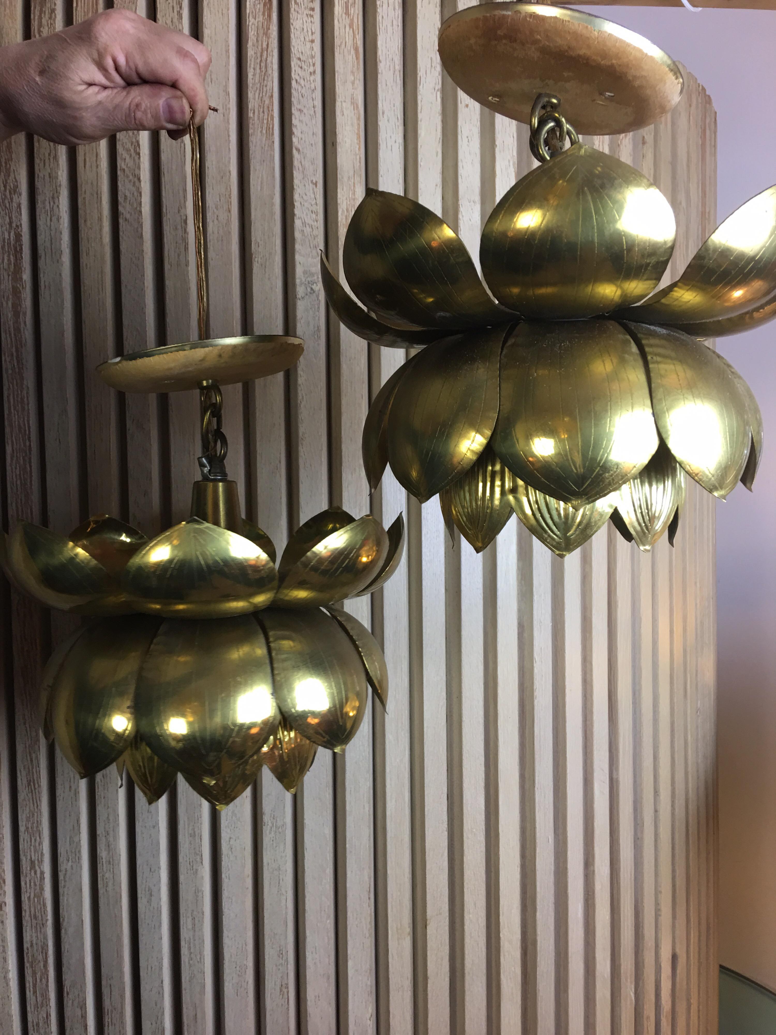 Nice pair of lotus pendants by the Feldman Lighting Company. Manufactured in Hong Kong in the early 1960s brass is in very nice condition, could be polished or left with their patina. Very easy to add chain to have these hang down at any length!