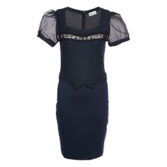 Used The fine artistry and the feminine silhouette of this designer dress exhibit the