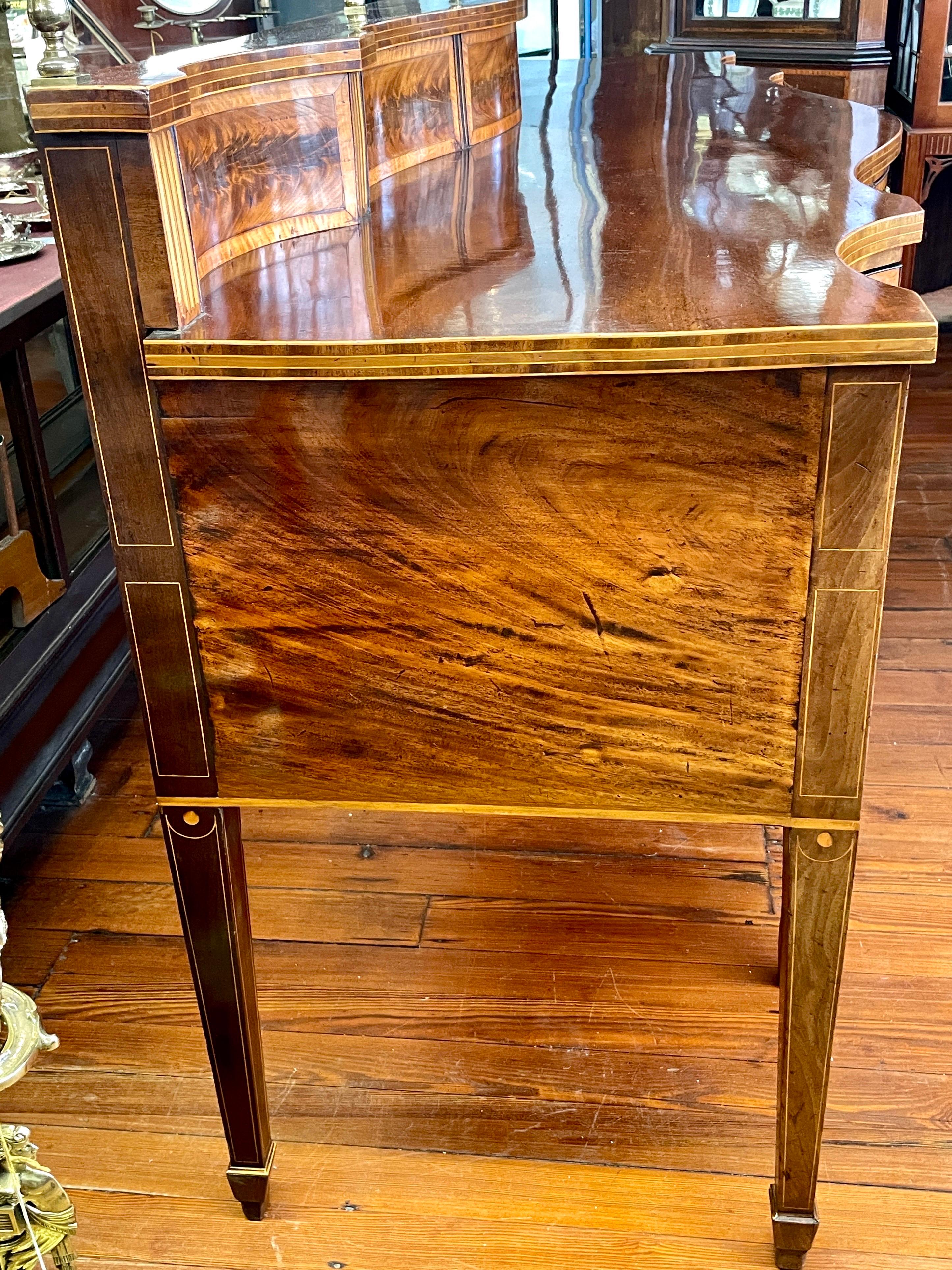 Brass THE Finest late 18th C. inlaid flame mahogany Hepplewhite Serpentine Sideboard