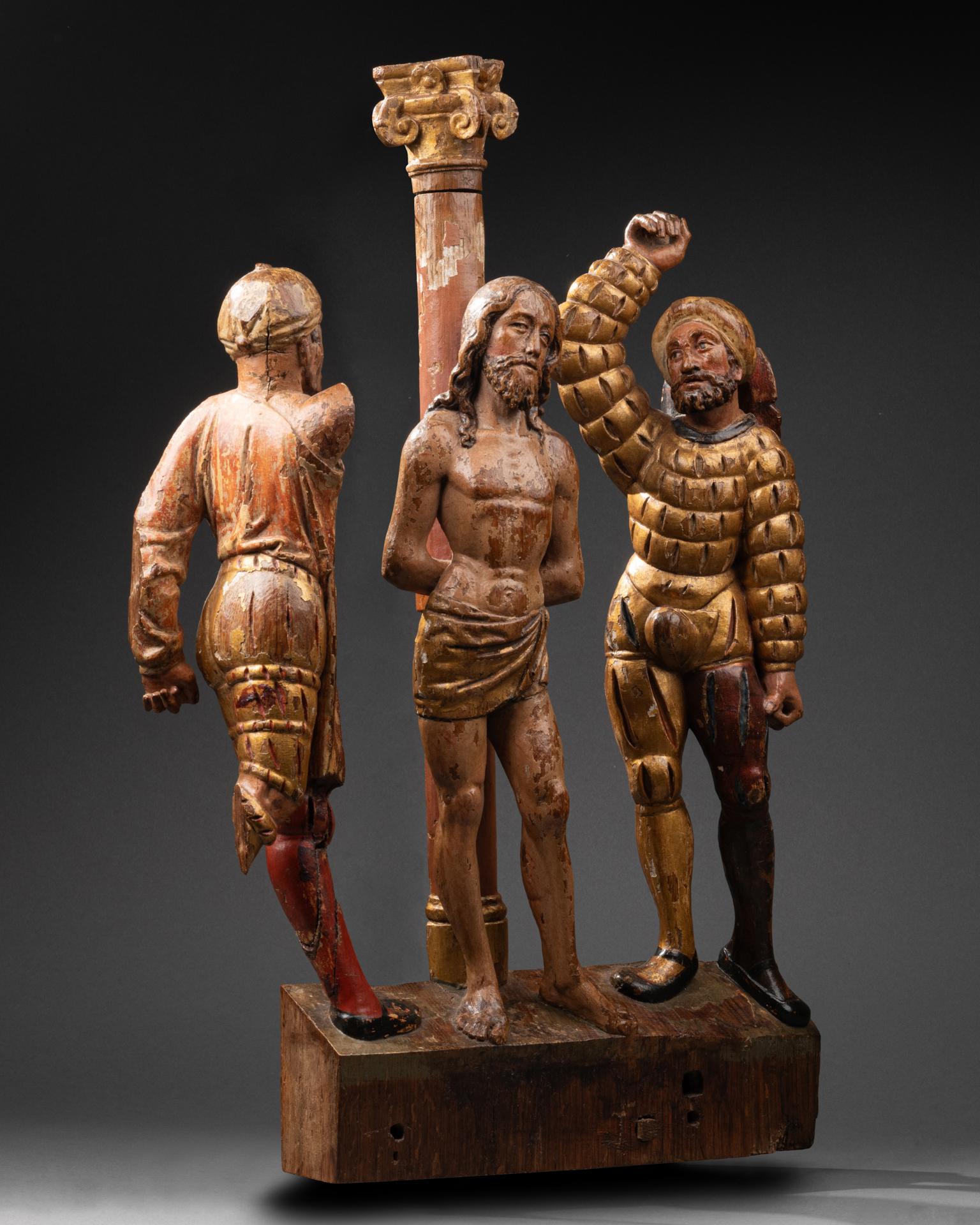 Altarbildgruppe mit der Darstellung der Geißelung
Brabant, um 1560-1580
Holz geschnitzt, polychrom und vergoldet
50 x 38 x 7 cm

In der Mitte der Gruppe steht Christus aufrecht an die Säule gelehnt, die Handgelenke hinter dem Rücken gefesselt, das