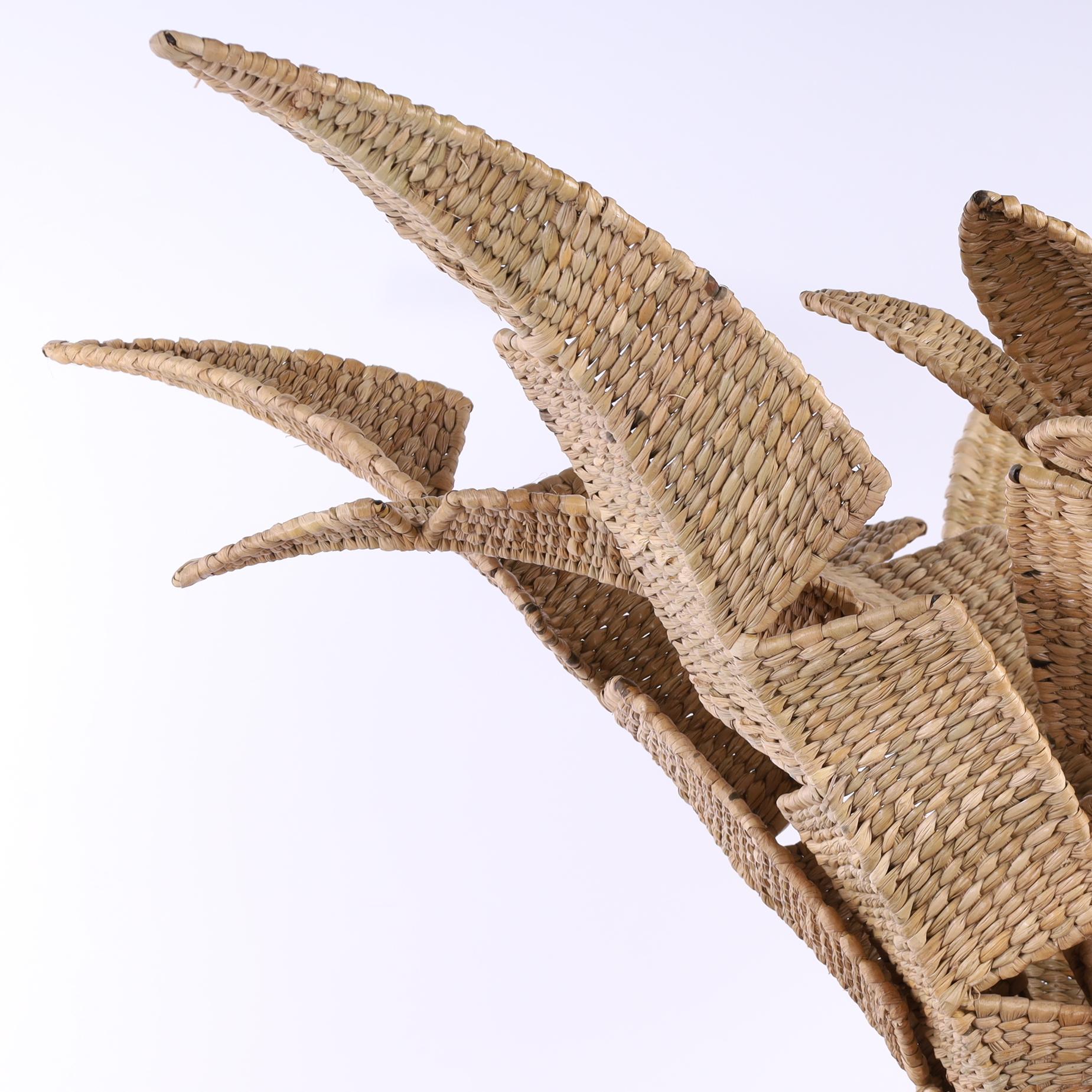 The Florencia Pequeña faux palm leaf eight light chandelier or light fixture handcrafted with woven reed over a metal frame in a casual elegant form. Exclusively designed and manufactured by F.S. Henemader Antiques.