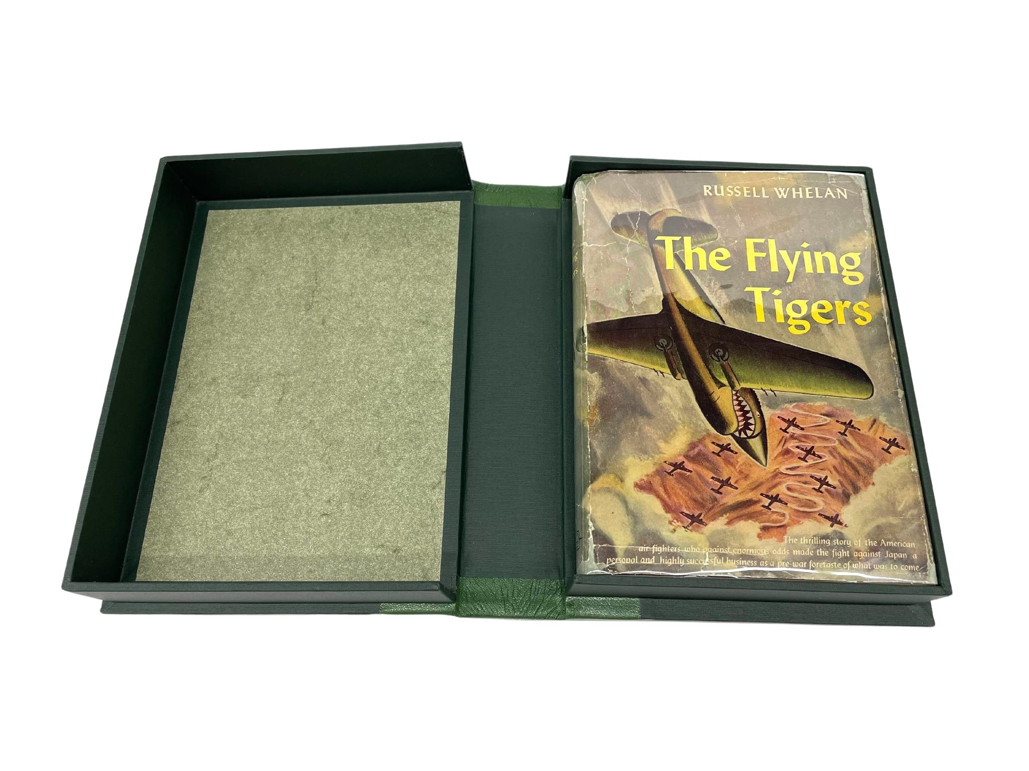 Whelan, Russell. The Flying Tigers. The Story of the American Volunteer Group. Garden City: Garden City Publishing Co., Inc., [1944]. Early edition. Signed by 17 members of the American Volunteer Group. 8vo. Publisher’s gray cloth, front board
