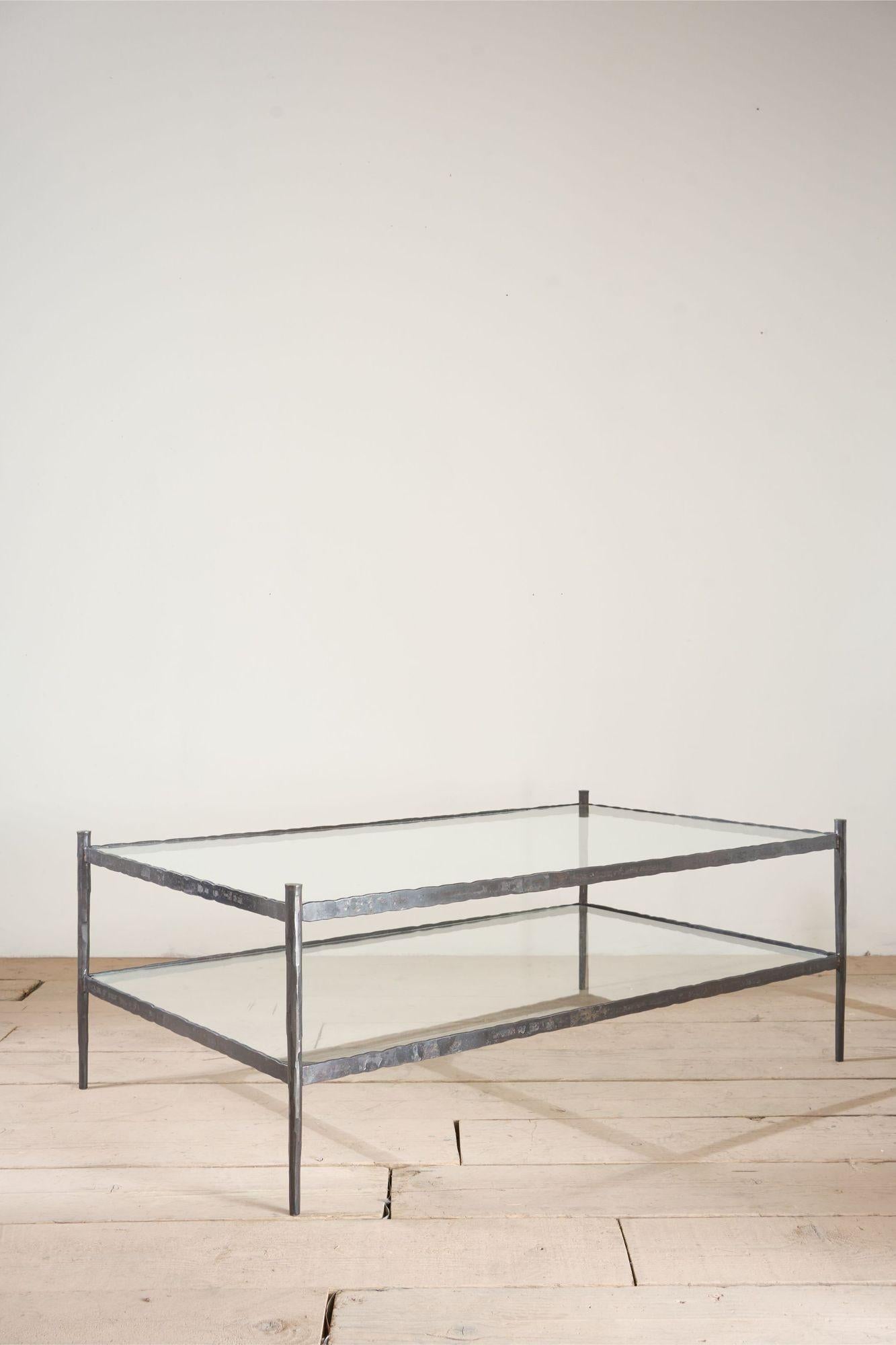 This is our 'Mjolnir' Coffee table. The hammer of Thor. An homage to the hammering techniques used in the manufacturing process. Made from forged steel and crafted right here in Yorkshire by Sam our incredible blacksmith.

The way Sam forges the