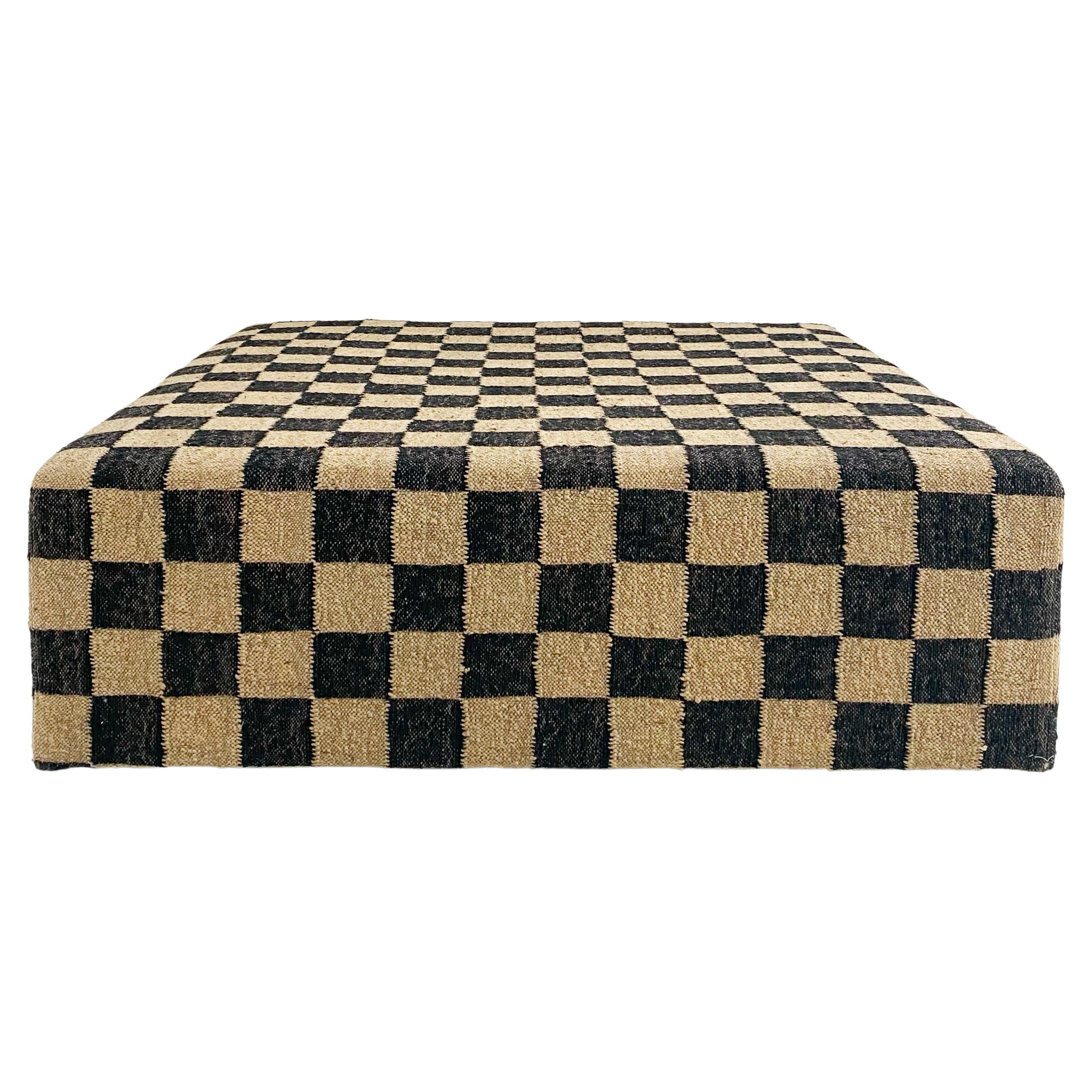 The Forsyth checkerboard ottoman is designed and handcrafted from our best-selling wool and jute checkerboard rugs. This is a versatile piece for any room adding natural texture and pattern. The perfect coffee table, ottoman, or extra seating. Each