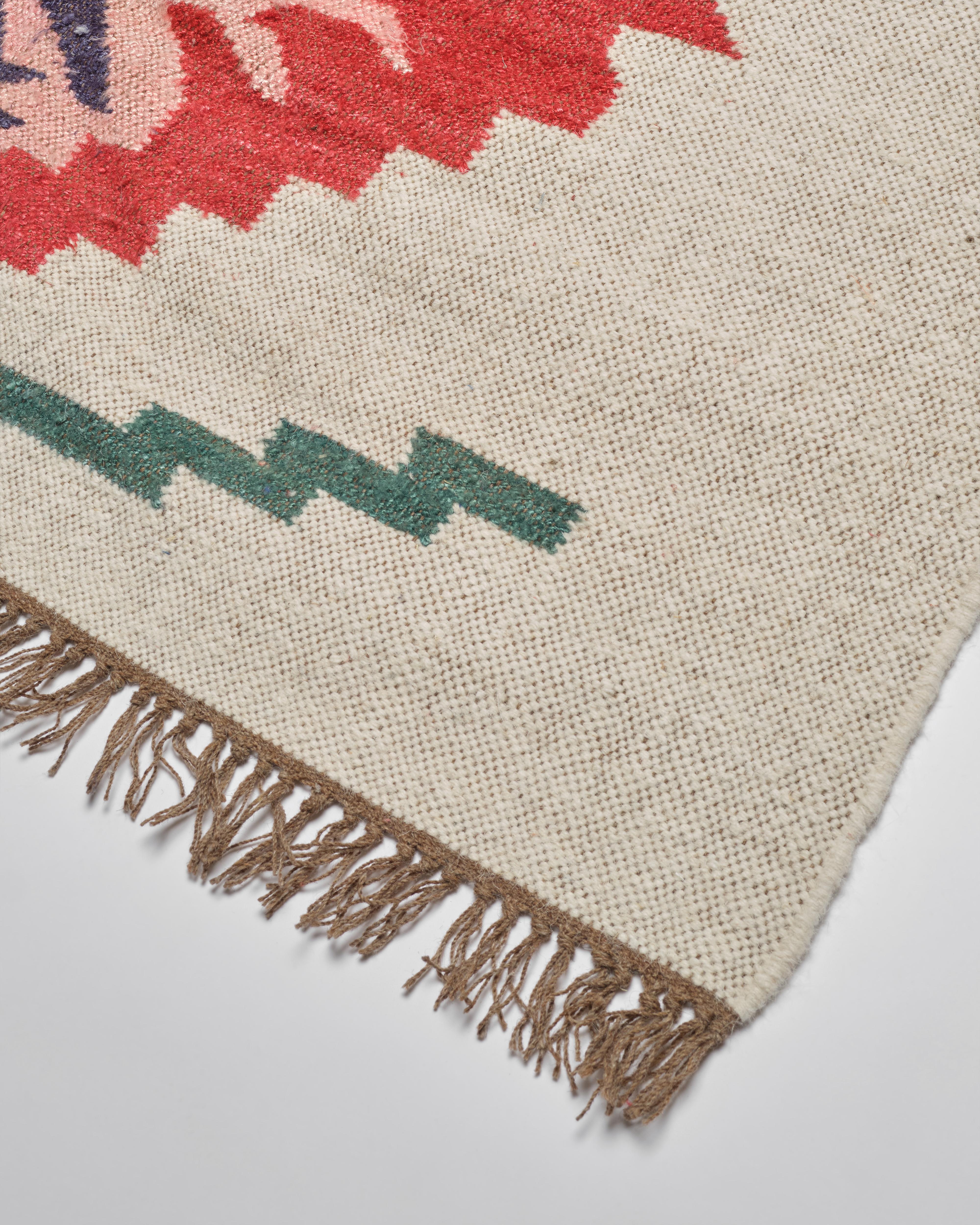 Our beautiful banana silk and jute rugs are expertly handwoven in Jaipur, India. The soft banana silk and wool combination is woven into a beautiful, floral motif, a perfect splash of color. The flat weave is perfect for layering or on its own.