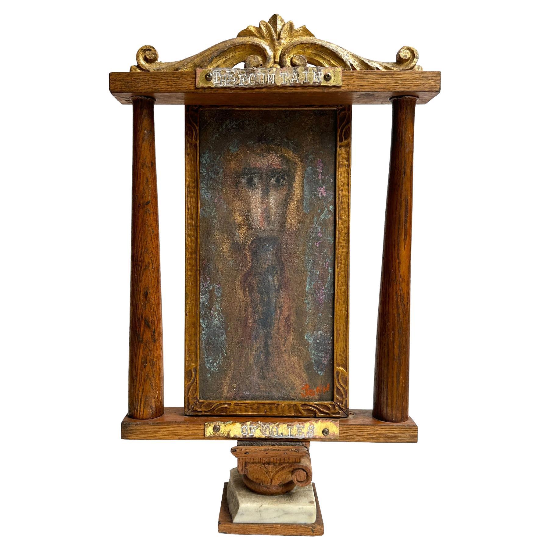Self-taught artist John Seubert, AKA John Dolly, uses objects he uncovers as he rehabs older homes in Chicago. This piece has a figurative painting mounted as a shrine then set upon a corinthian capital and a granite stand. A metal plaque at the top