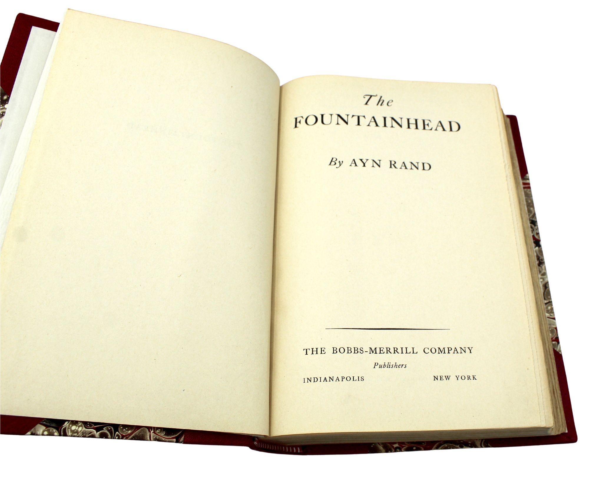 Rand, Ayn. The Fountainhead. New York: The Bobbs-Merrill Company, 1943. First edition printing. Octavo. Rebound in modern half red Moroccan leather and marbled boards, with gilt tooling and titles to the spine, and the original dust jacket bound-in.