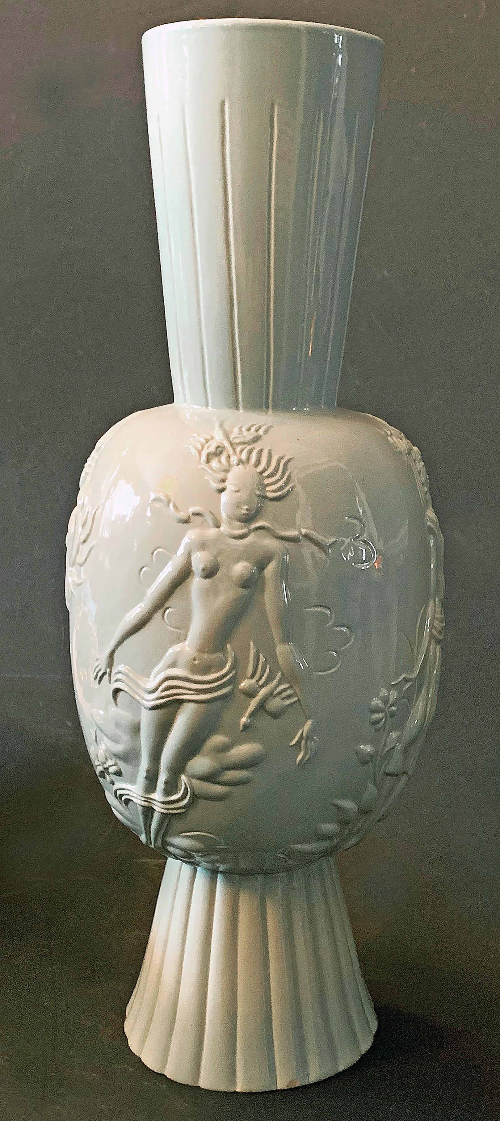 Sculpted, fired and glazed by one of the Vienna Werkstatte's greatest artists -- Wally (or Vally) Wieselthier -- after she emigrated to America, this tall, extraordinary vase depicts the four elements -- water, air, fire and earth. Each of the