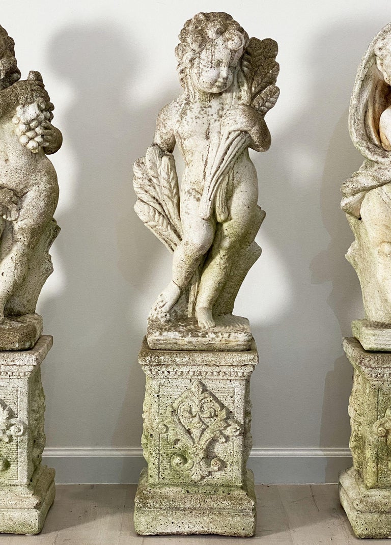 The Four Seasons Cherub Statues on Pedestals, Garden Stone Statuary at
