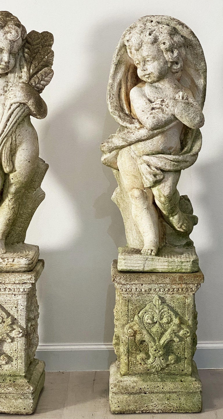 The Four Seasons Cherub Statues on Pedestals, Garden Stone Statuary at