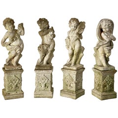 The Four Seasons Cherub Statues on Pedestals, Garden Stone Statuary