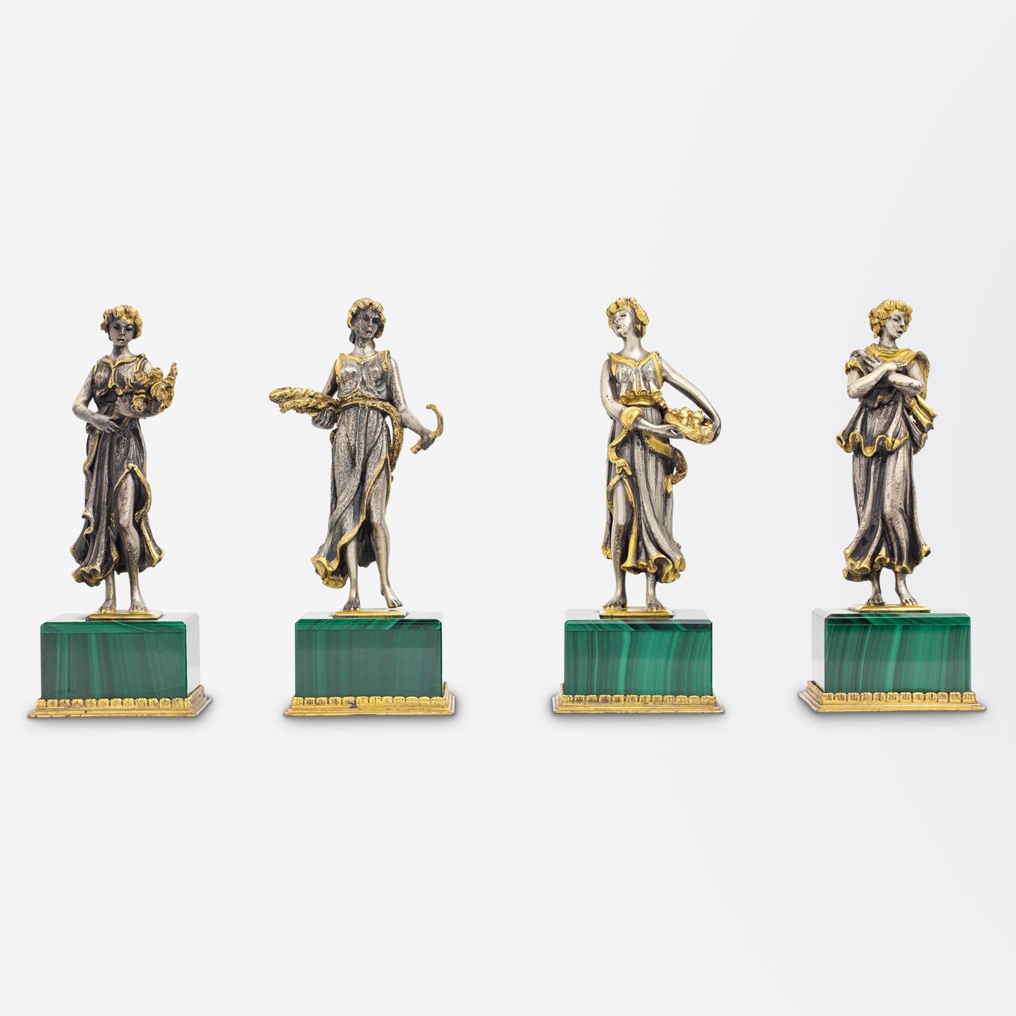 This charming set of 'The Four Seasons' dates to the late 1960s and was manufactured in Milan, Italy. The set which retain their original fitted box comprise of a small square plinth encased with slices of malachite atop of which sit a figure, each