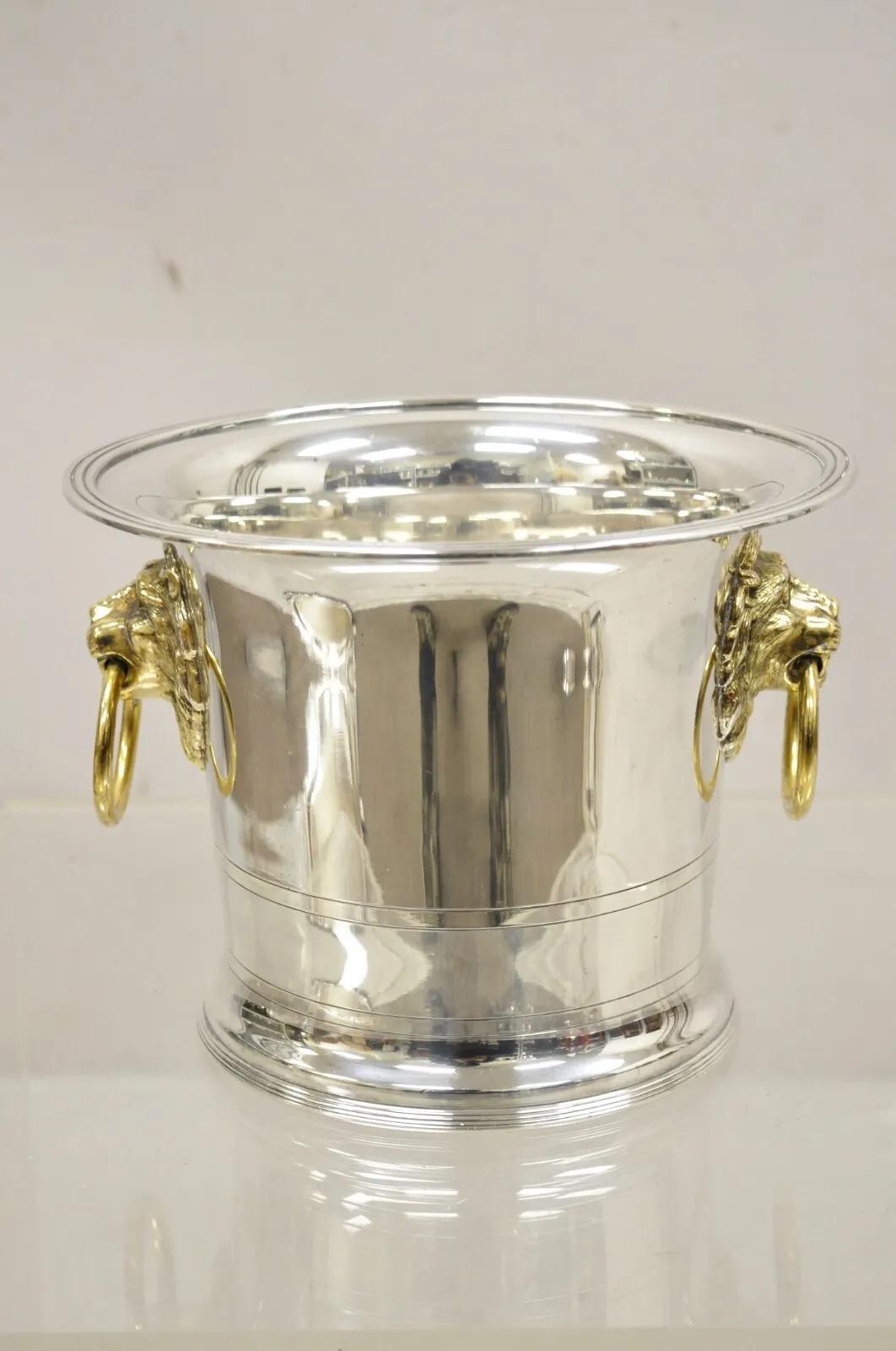 The Franklin Mint 1986 Silver Plated Fluted Champagne Chiller Lion Ice Bucket. Item features a brass lion head drop pulls, original hallmark. Circa 1986. Measurements: 7