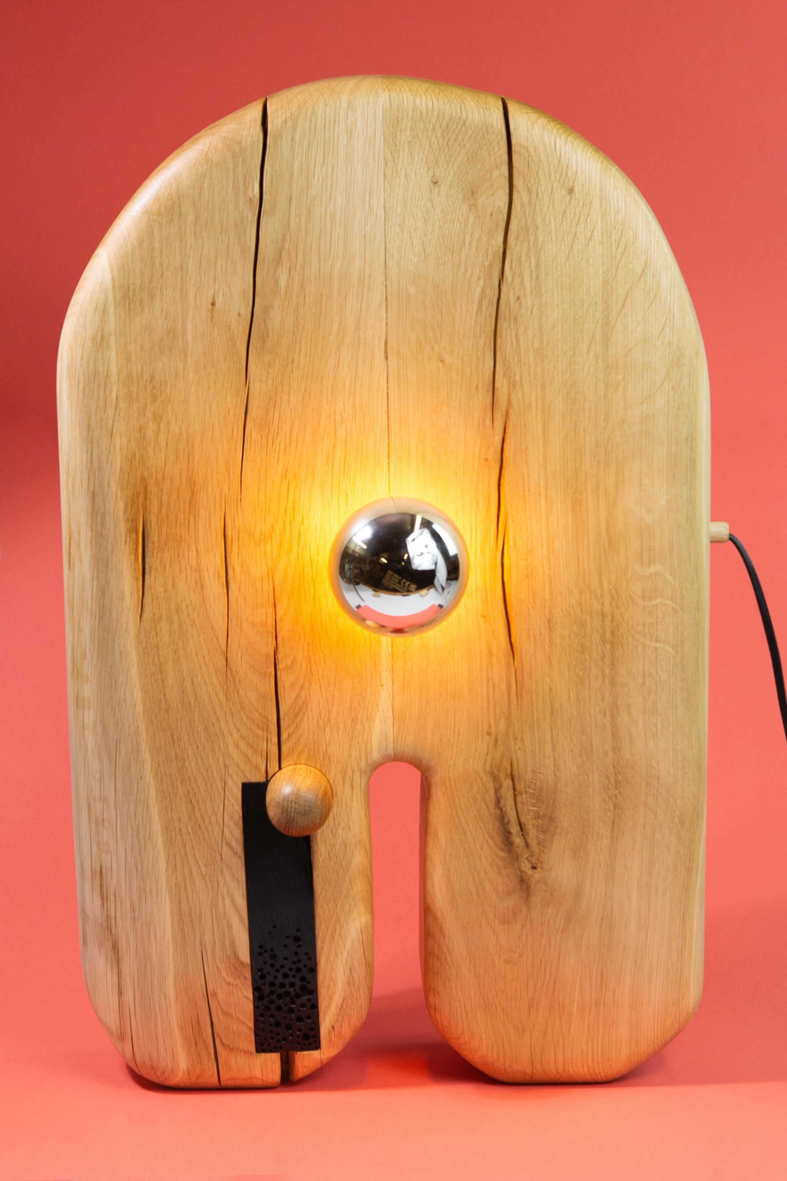 Hand carved lamp. White oak body with india ink accented pores. 