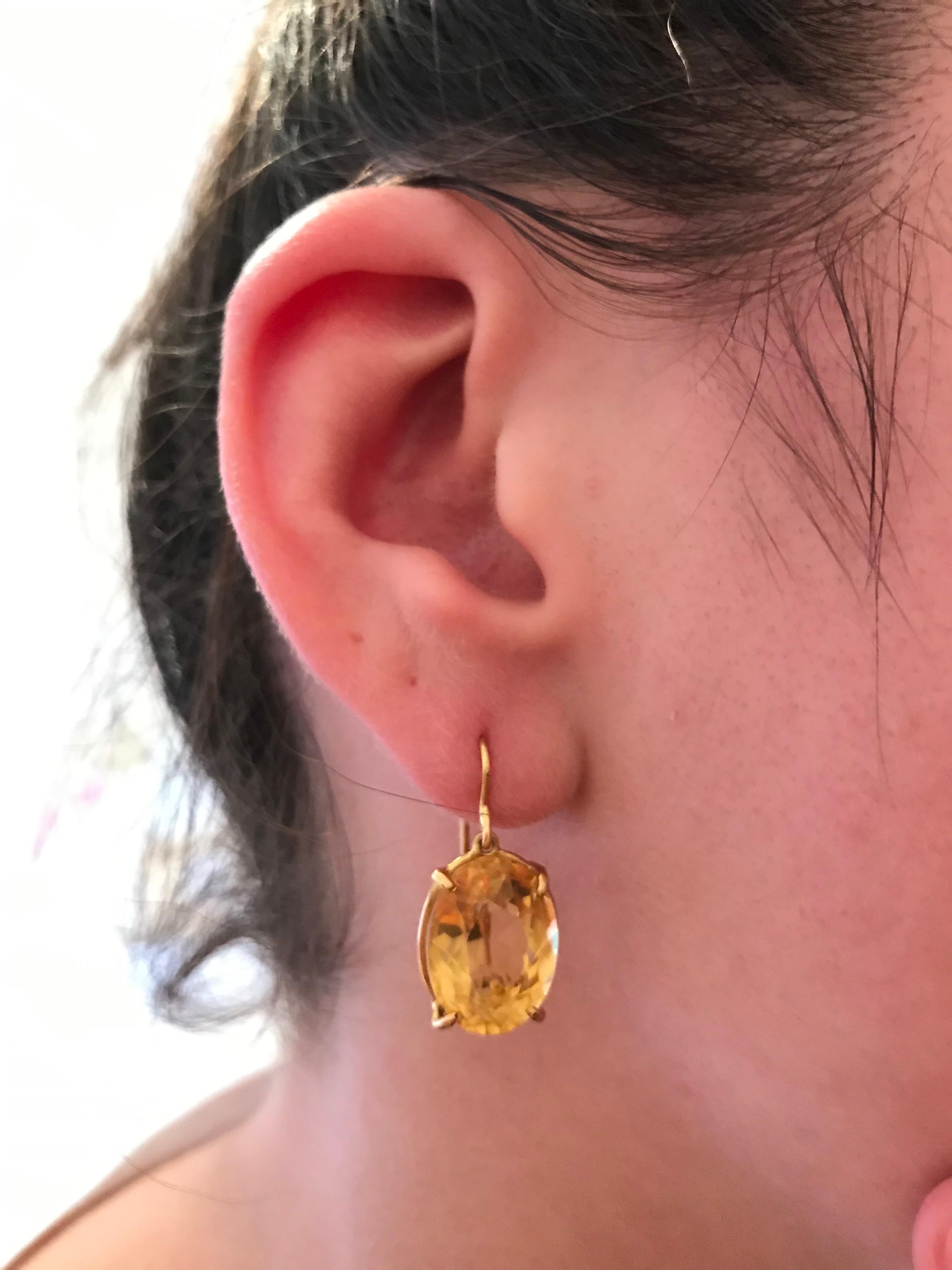 The Gabriella Hanging Stone Earring.  This Dangling French Wire Earring is finished with an Oval Faceted Citrine and Four delicate Prongs.

The Oval Stone measures approximately 5/8