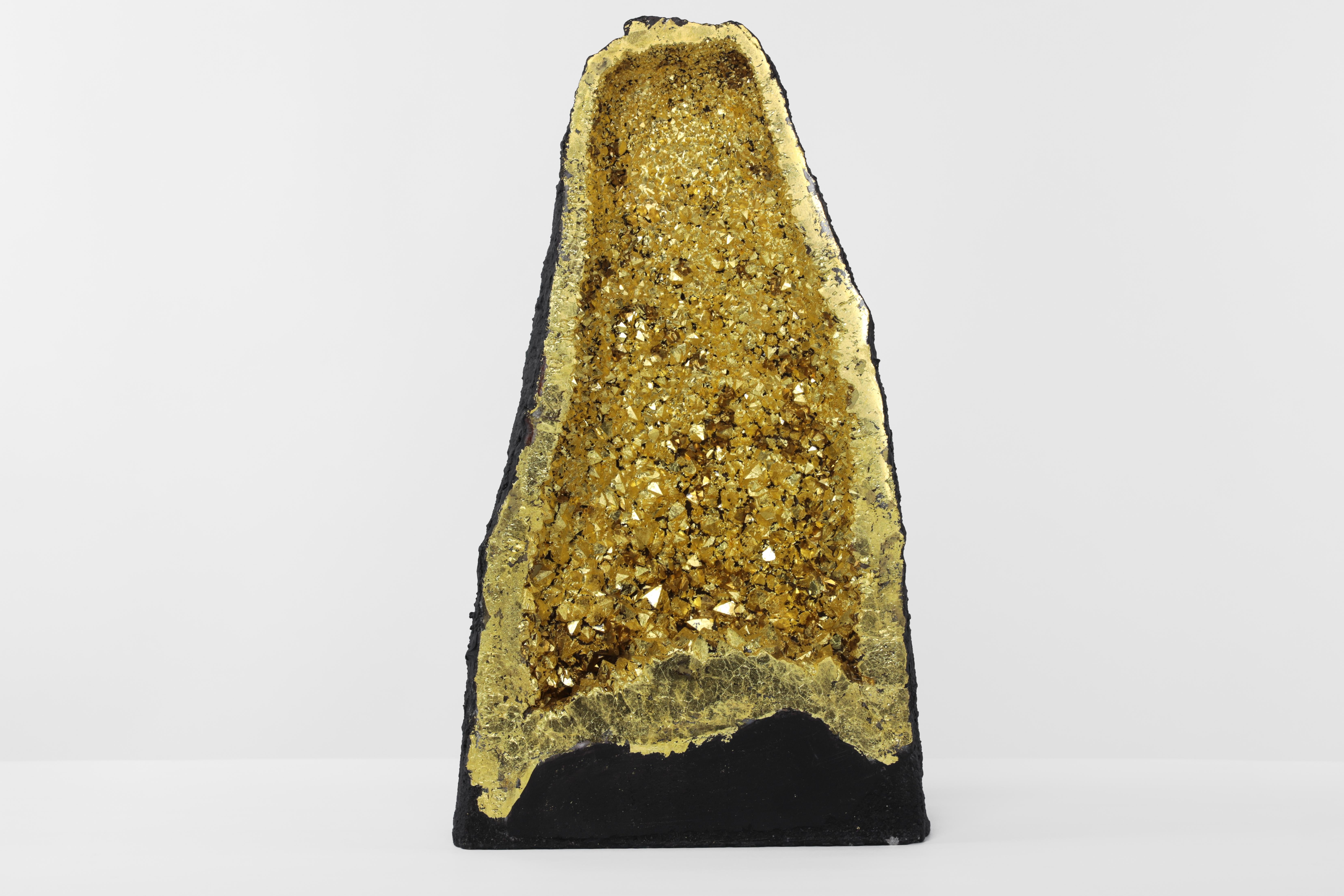 It's easy to imagine walking through a cave of shiny gold when gazing into the 22K gilt crystal geode cathedral. Like the ancient Japanese Gazing stone used for meditation and focusing on breathe, the Gazing Golden Cathedral acts the same. Sit and