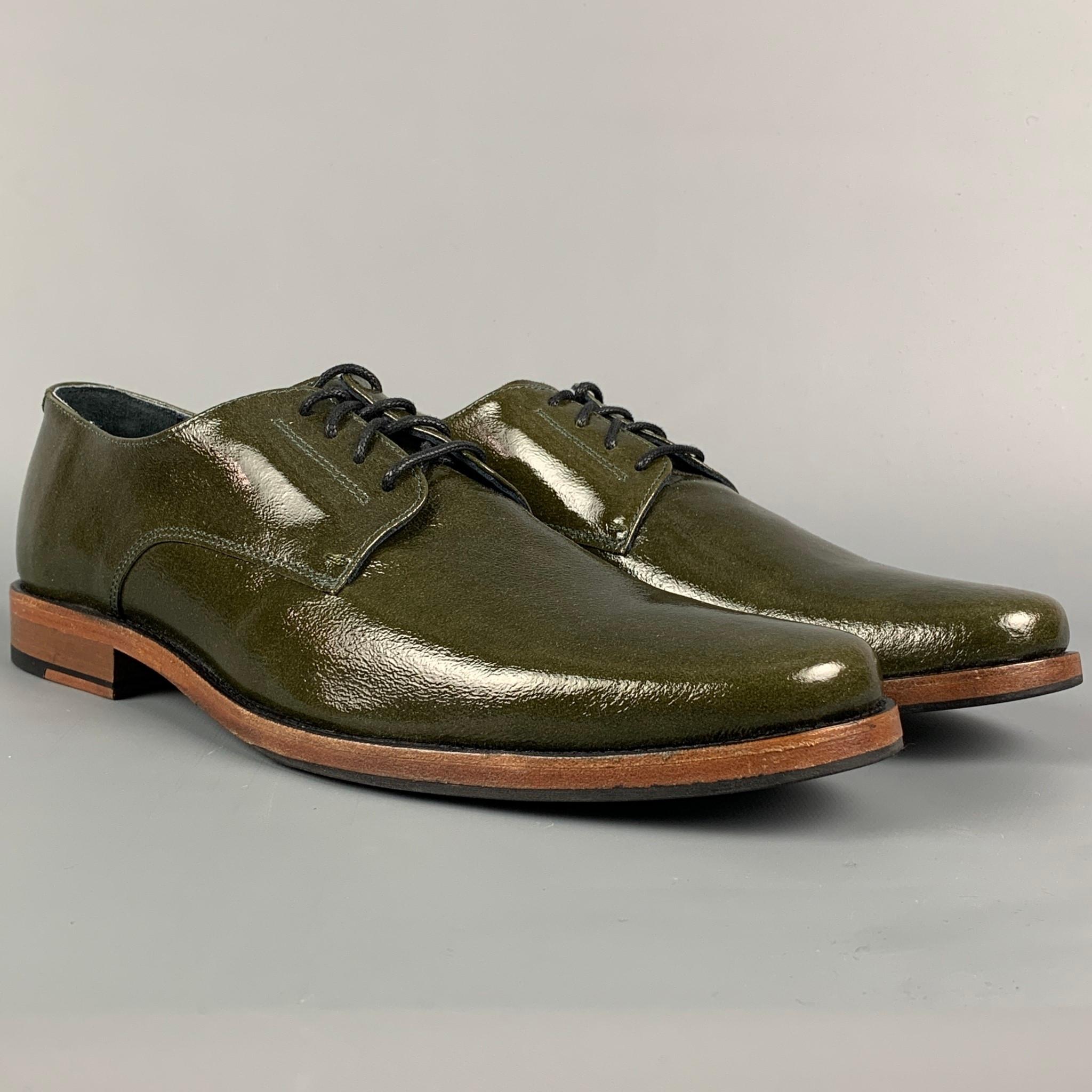 THE GENERIC MAN shoes comes in a olive patent leather featuring a round toe and a lace up closure. Made in Portugal. 

Excellent Pre-Owned Condition.
Marked: 43

Outsole: 12.25 in. x 4 in. 