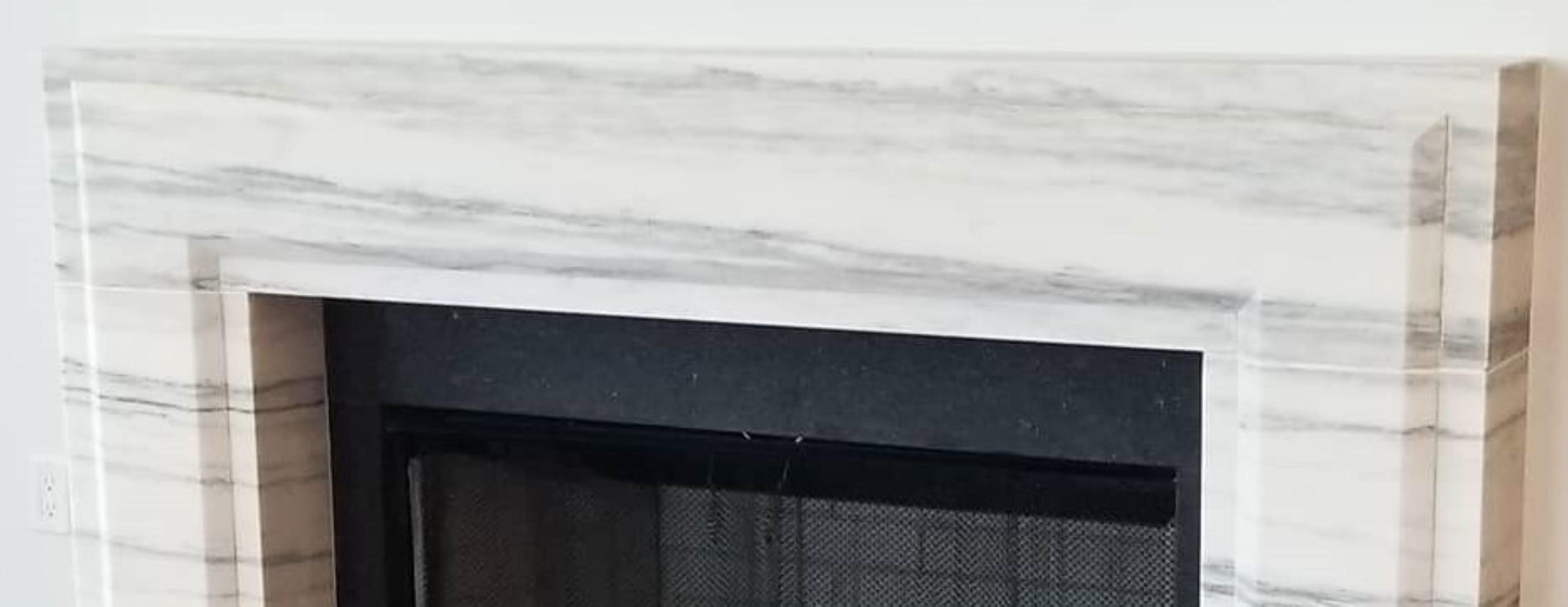 Sculpté La Gerherty : une cheminée moderne en pierre avec un biseau en vente