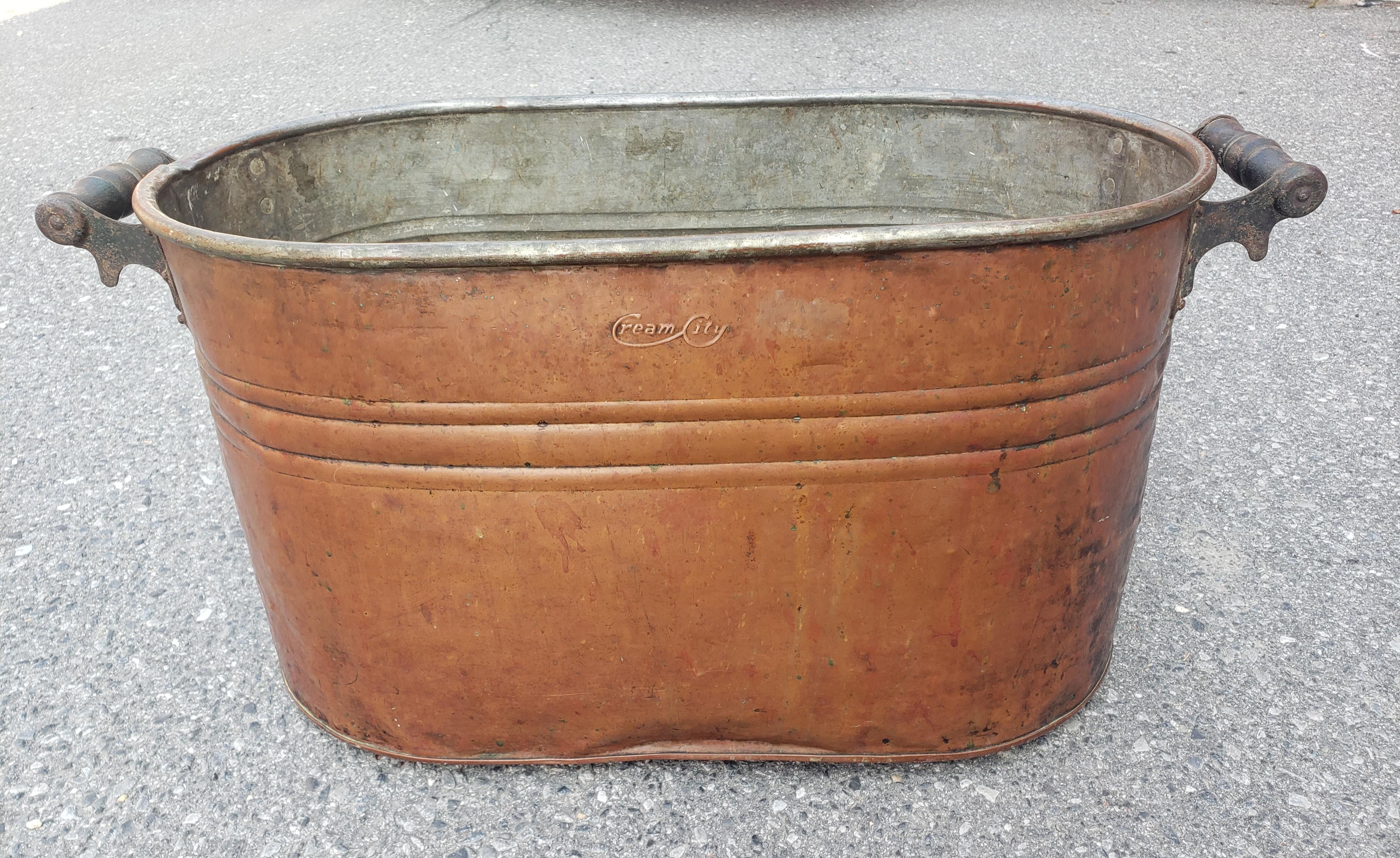 This antique copper finish wash boiler is marked CREAM CITY (Milwaukee). It's been lightly cleaned but not deeply polished, I left it in found vintage condition. It shows a lot of great character, with a few minor dents, aged copper with some