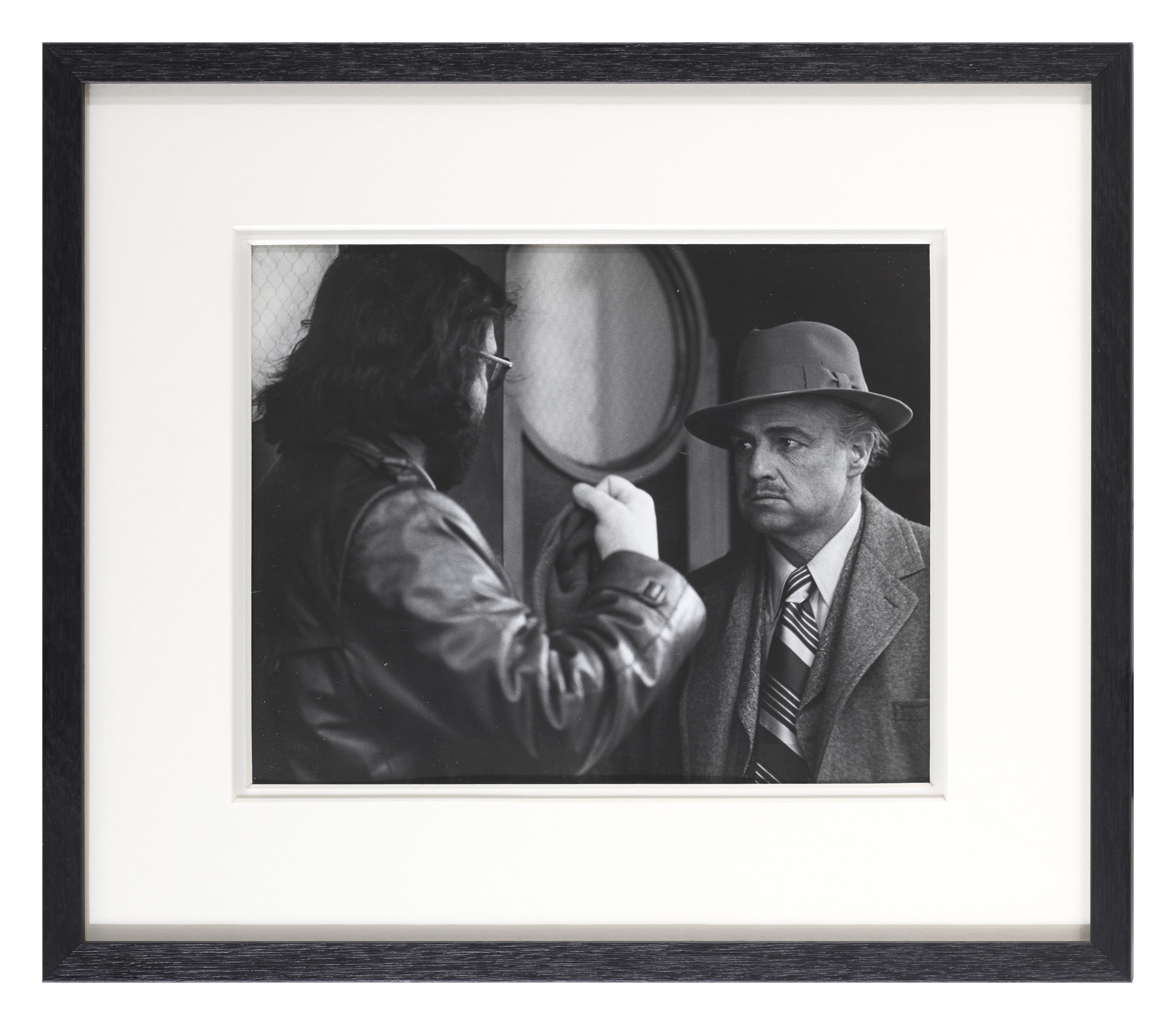 Original rare candid photographic production still for The Godfather 1972.
This photo shows Francis Ford Coppola on set with Marlon Brando.
This film starred Marlon Brando, Al Pacino and Robert Duvall and was directed by Francis Ford Coppola.
This