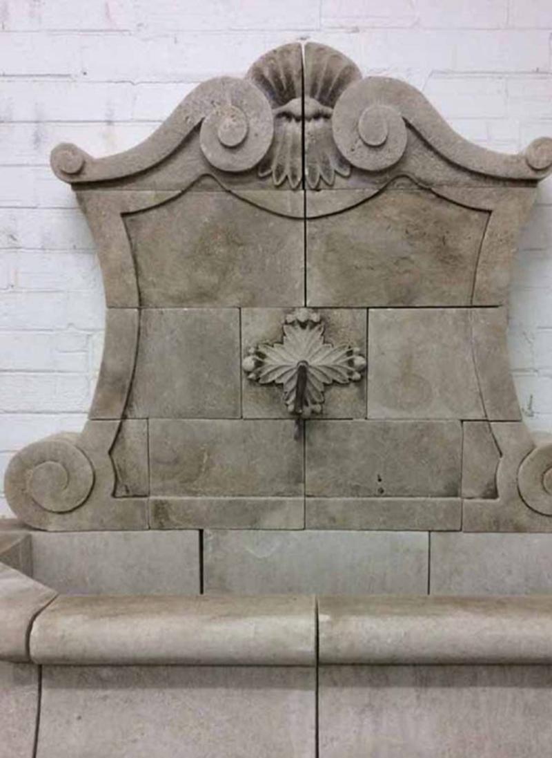Here we have a very ornate hand carved limestone wall fountain. Model: The Grande Murale, FO48.

Measurements are: Height 7', basin's height 2'4