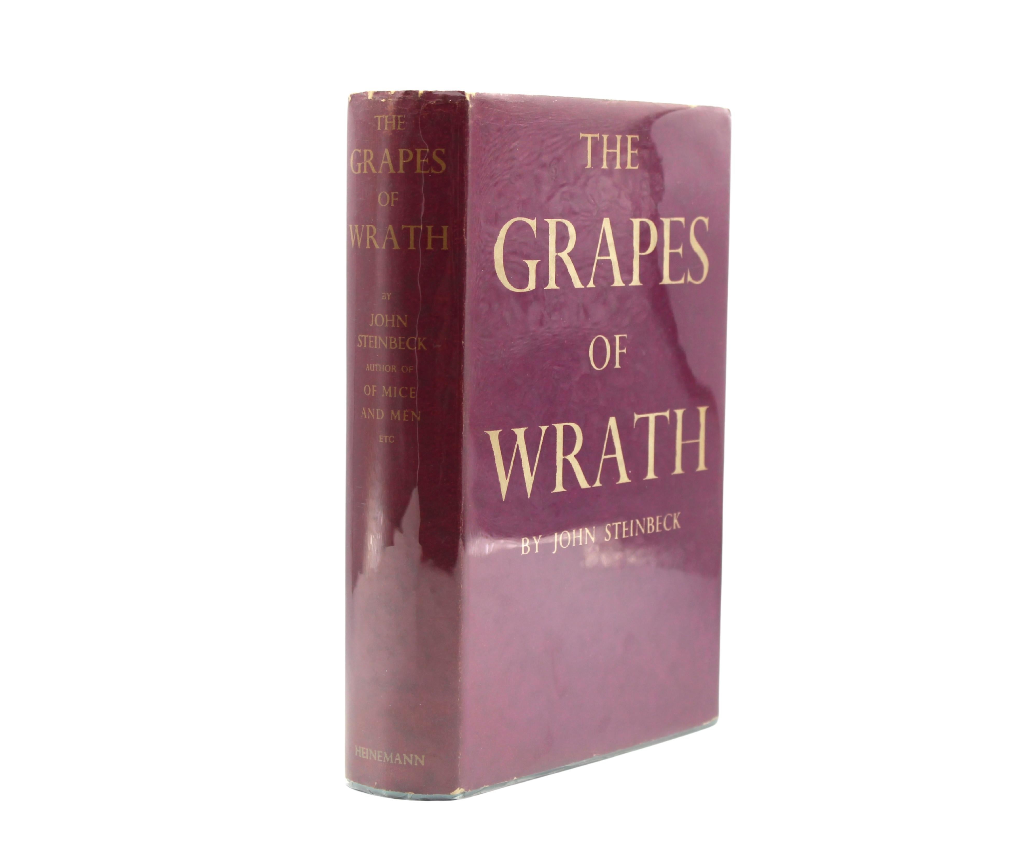 Steinbeck, John. The Grapes of Wrath. London and Toronto: William Heineman LTD, 1939. First UK Edition. In magenta and tan dust jacket and original blue cloth boards with gilt titles to the spine. 
Presented is a first UK edition of John Steinbeck’s