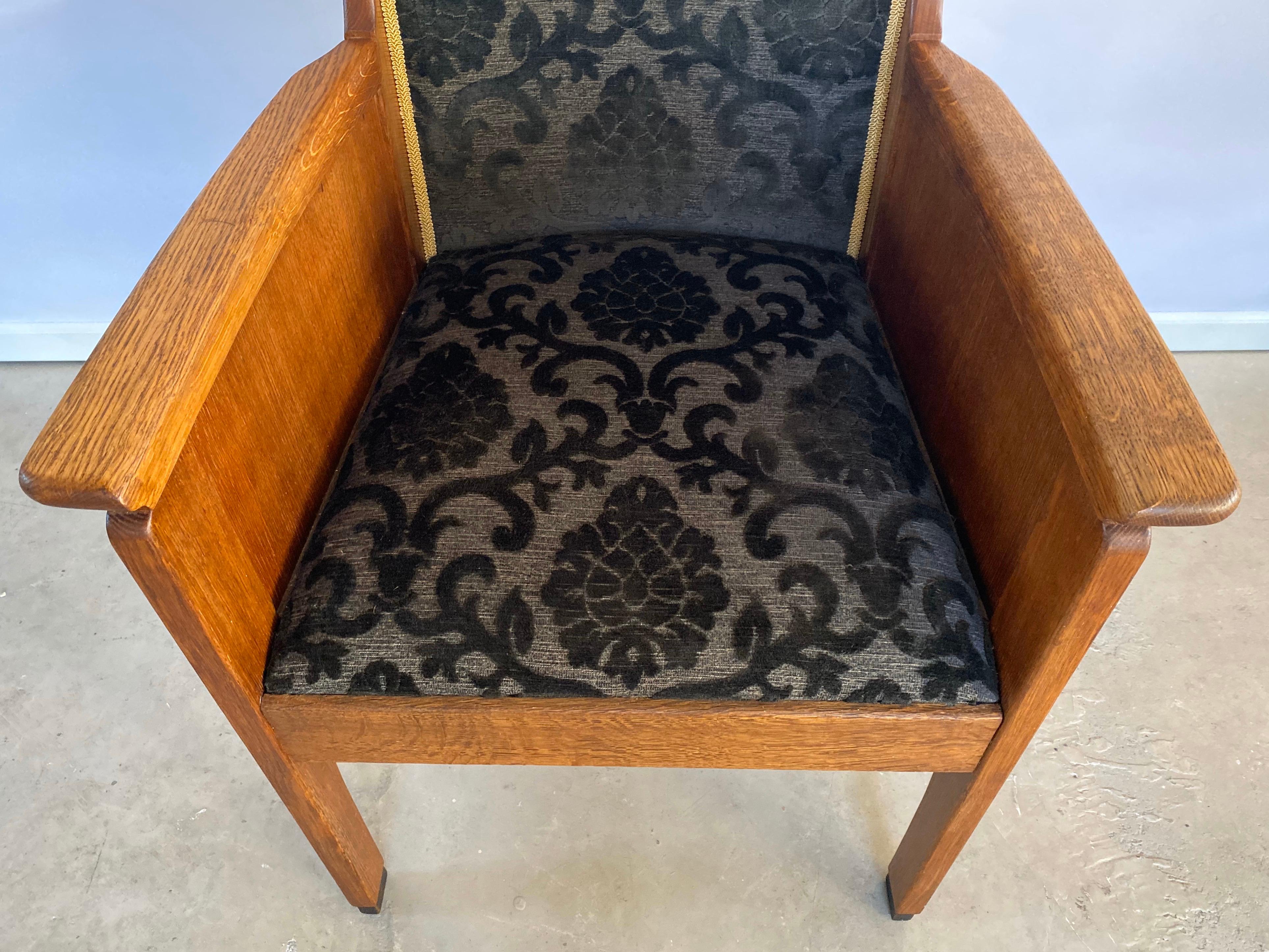 Beautiful example of a Haagse School (The Hague School) style Dutch Art Deco armchair. In contrary to the Amsterdam School, this architecture and design movement characterizes itself by the sharp contracting lines and the functionality rather than